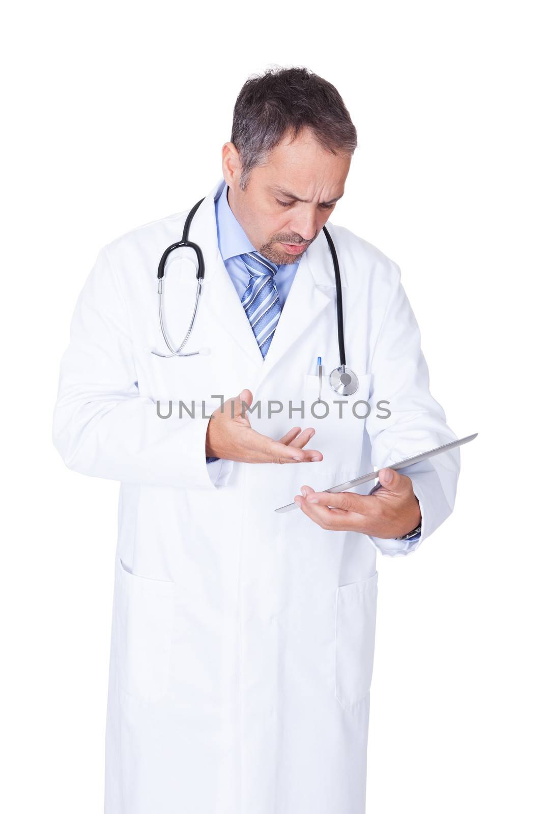 Portrait Of A Confident Doctor With Tablet by AndreyPopov