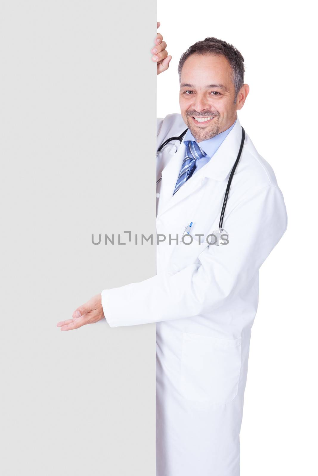 Portrait Of A Doctor Holding Blank Placard Isolated On White Background