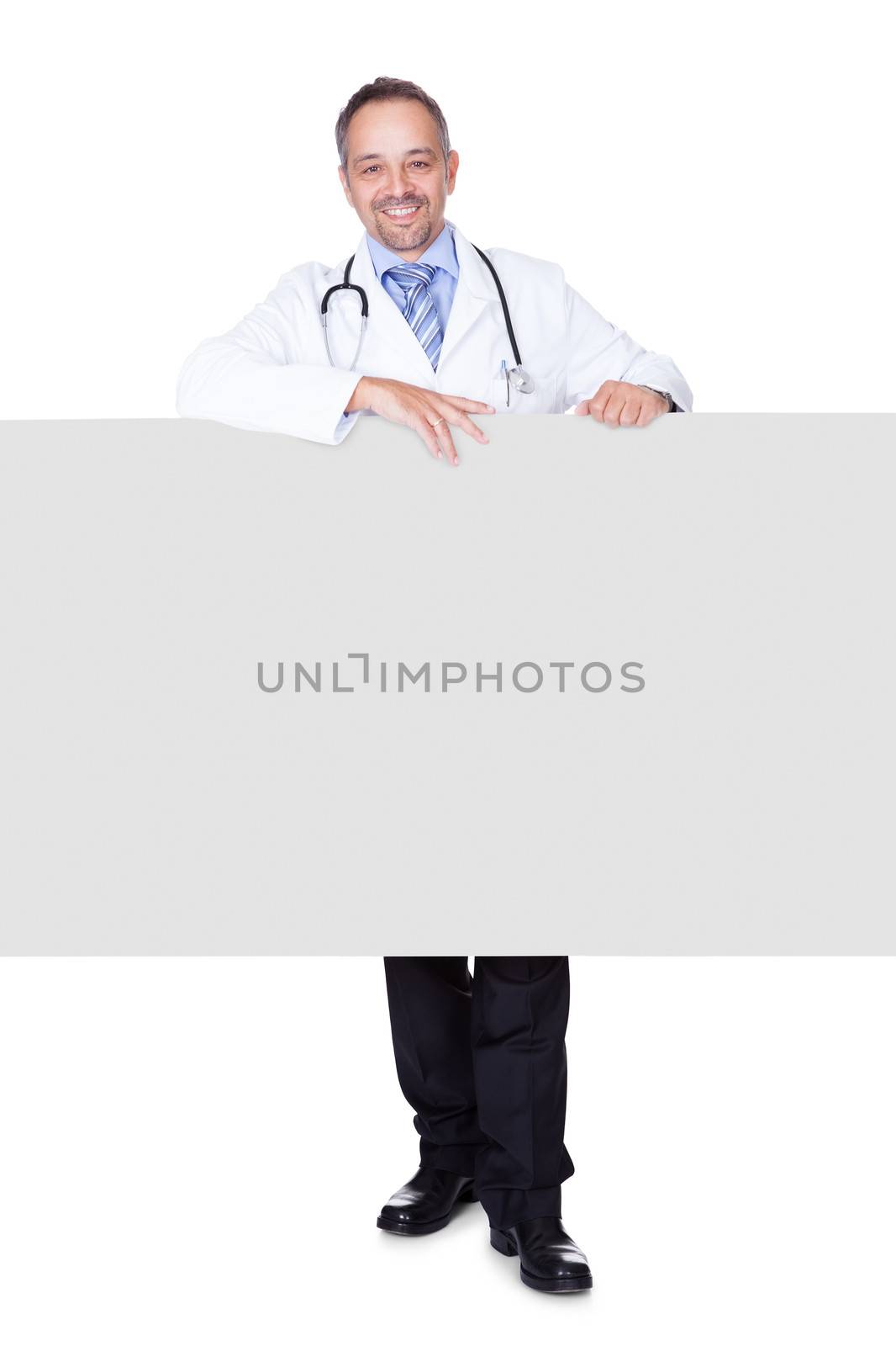 Portrait Of A Doctor Holding Blank Placard by AndreyPopov