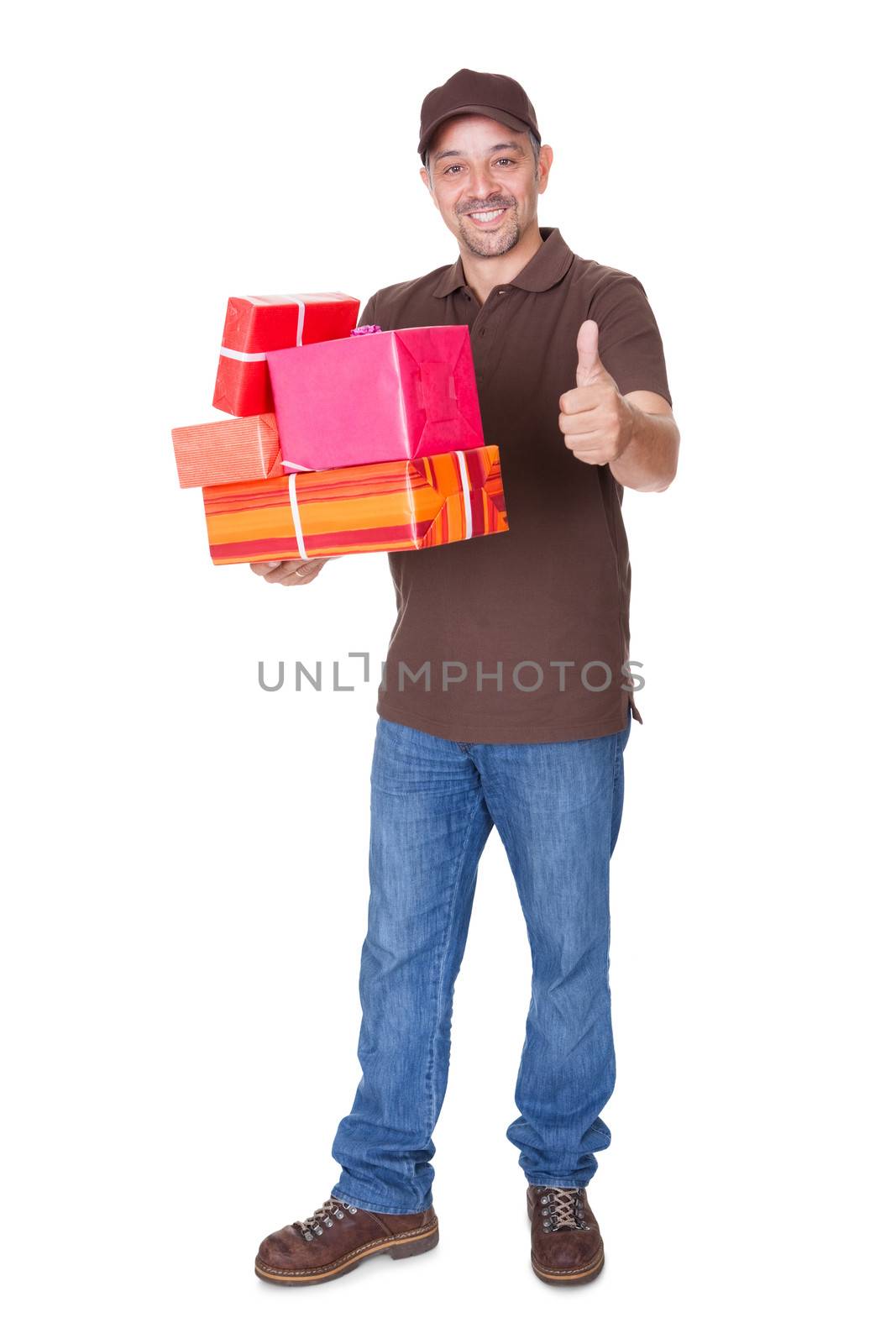 Portrait Of Happy Man Holding Gifts On White Background
