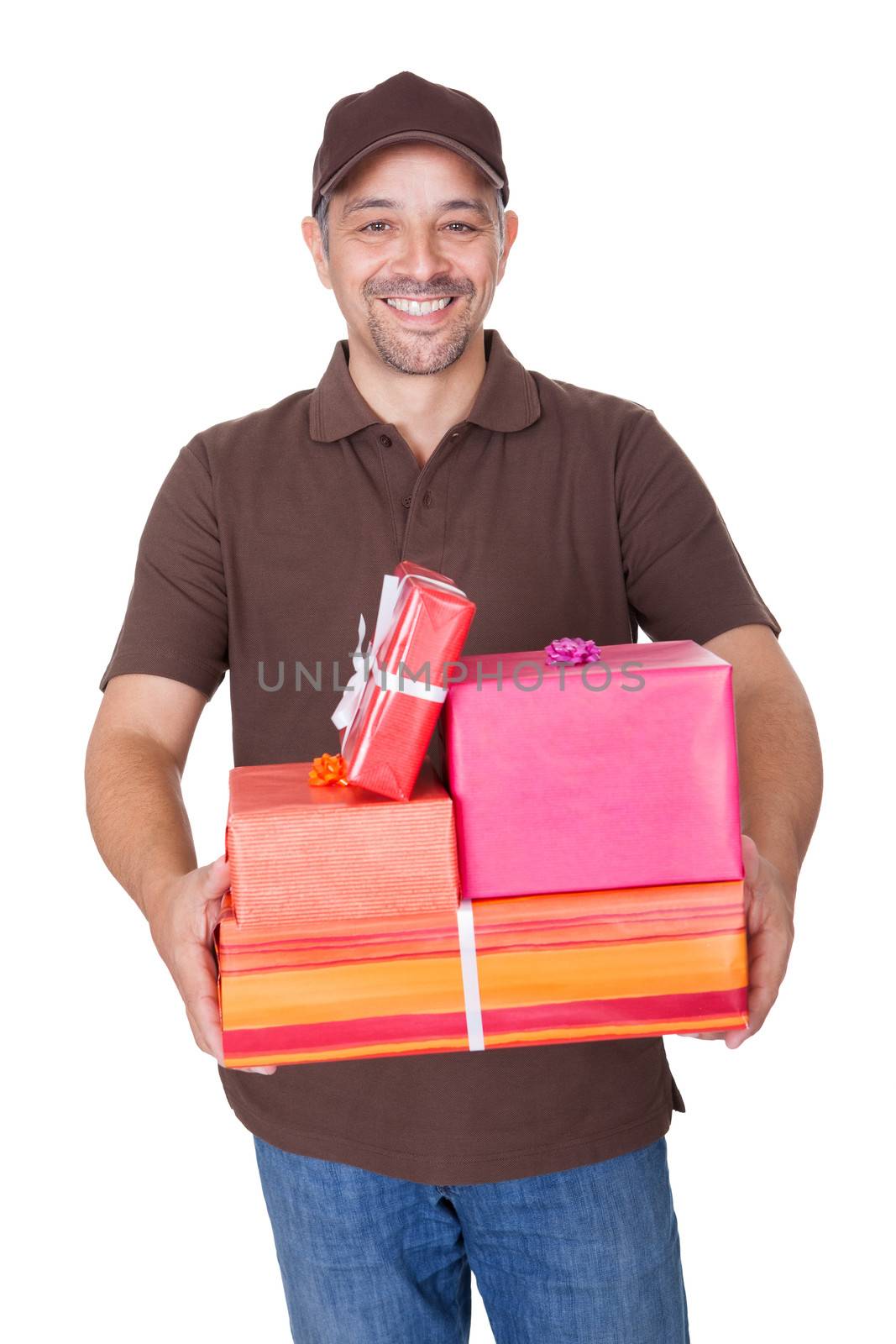 Portrait Of Happy Man Holding Gifts On White Background