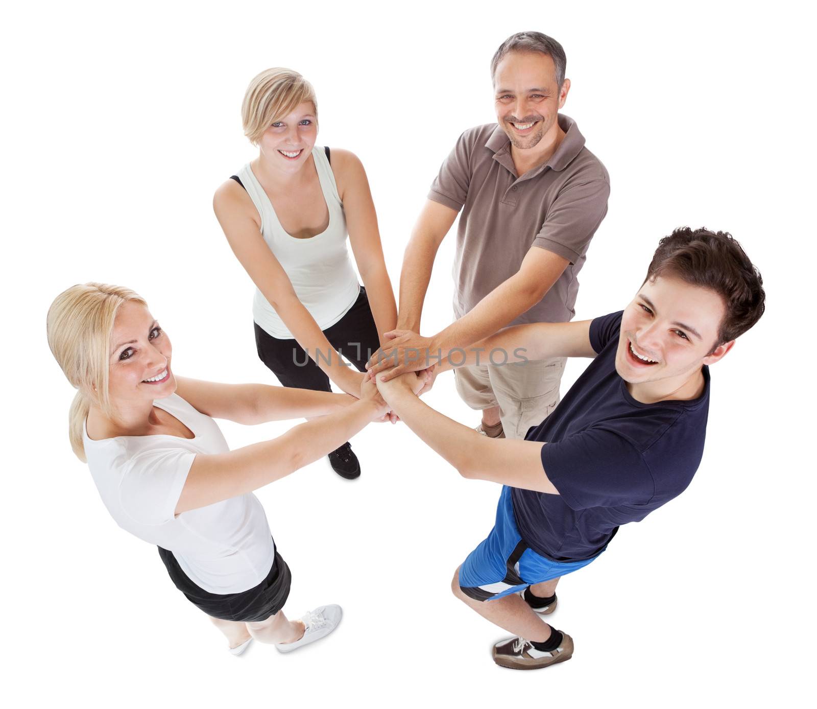High angle view of a happy family with a teenage son and daughter holding hands