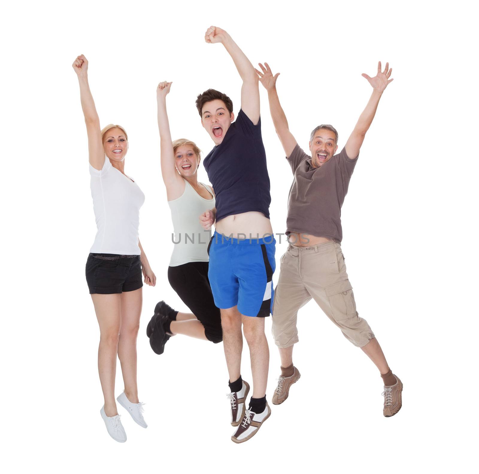 Happy excited family jumping. Isolated on white