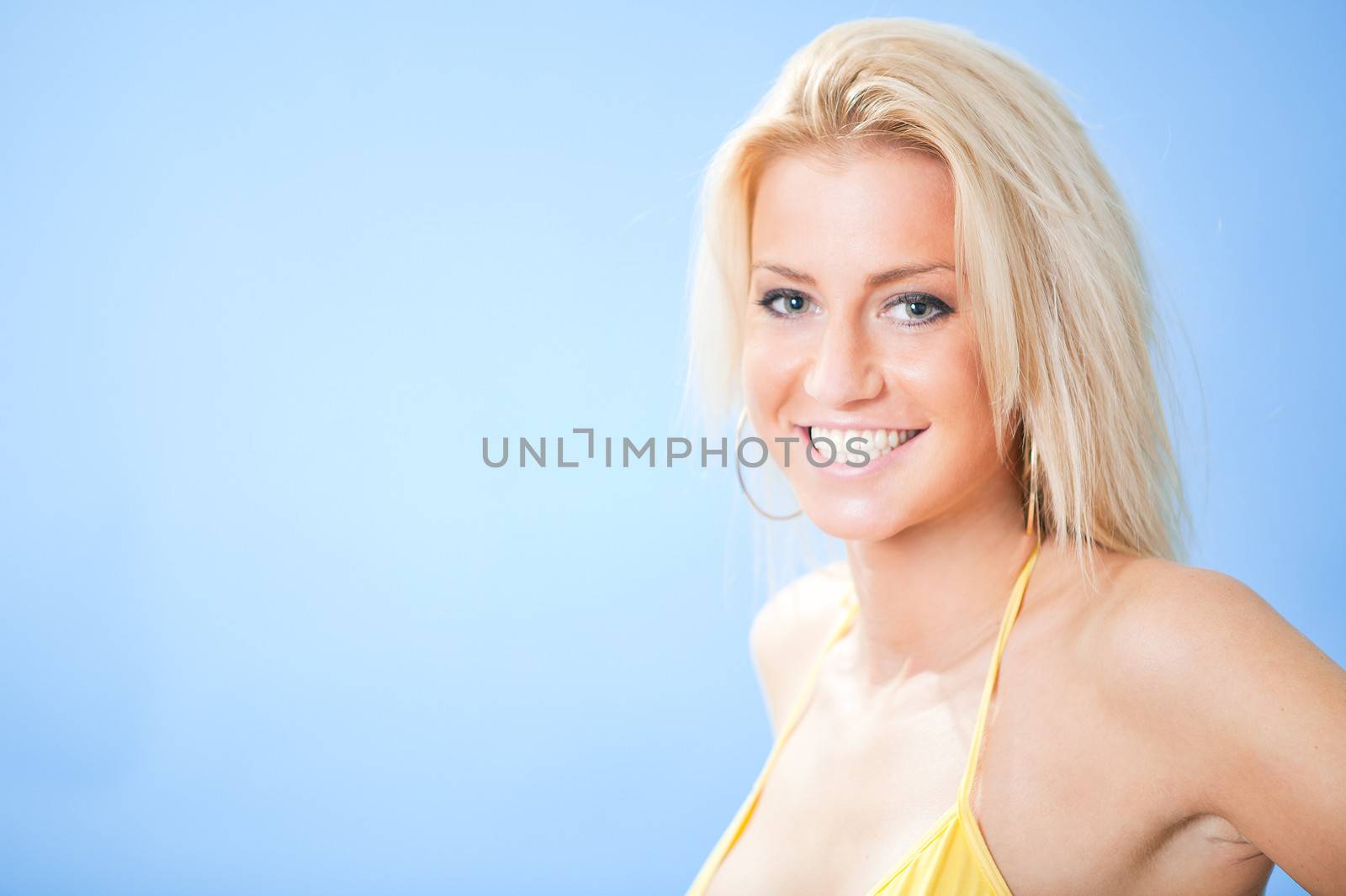 Beautiful young woman in bikini at the beach
