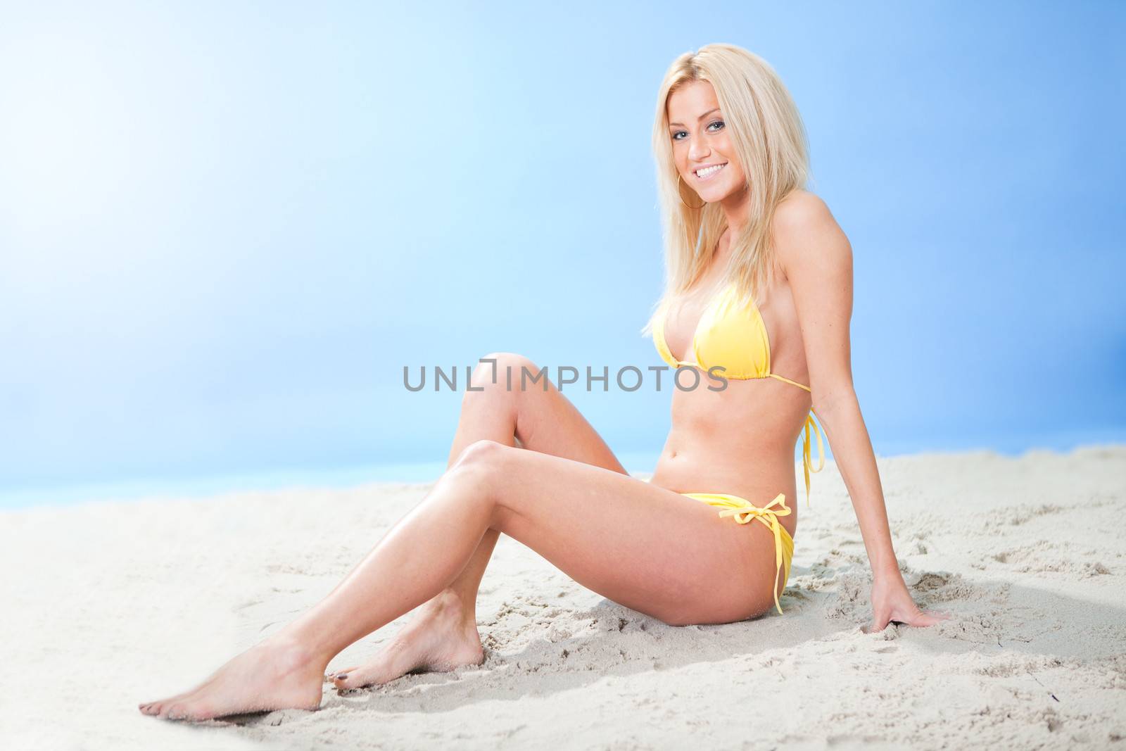 Beautiful young woman in bikini by AndreyPopov