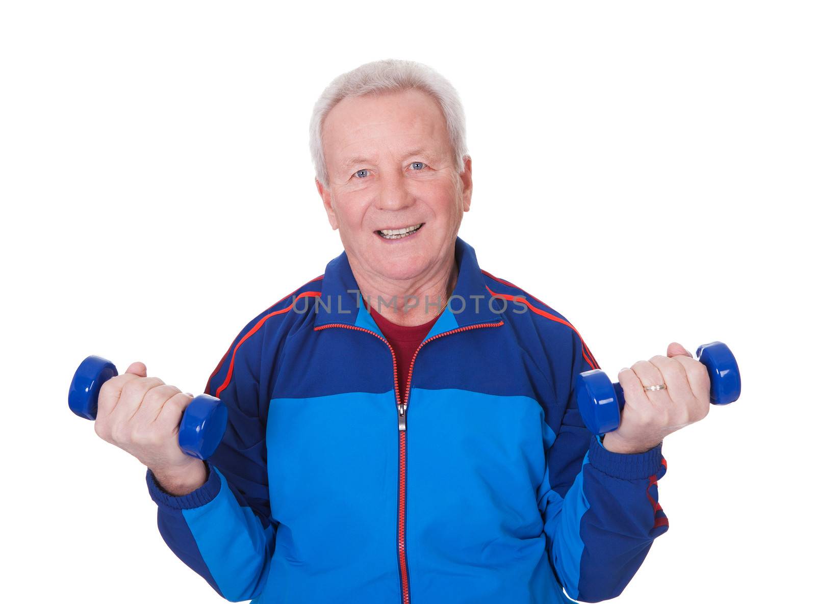 Portrait Of A Senior Man Exercising On White Background