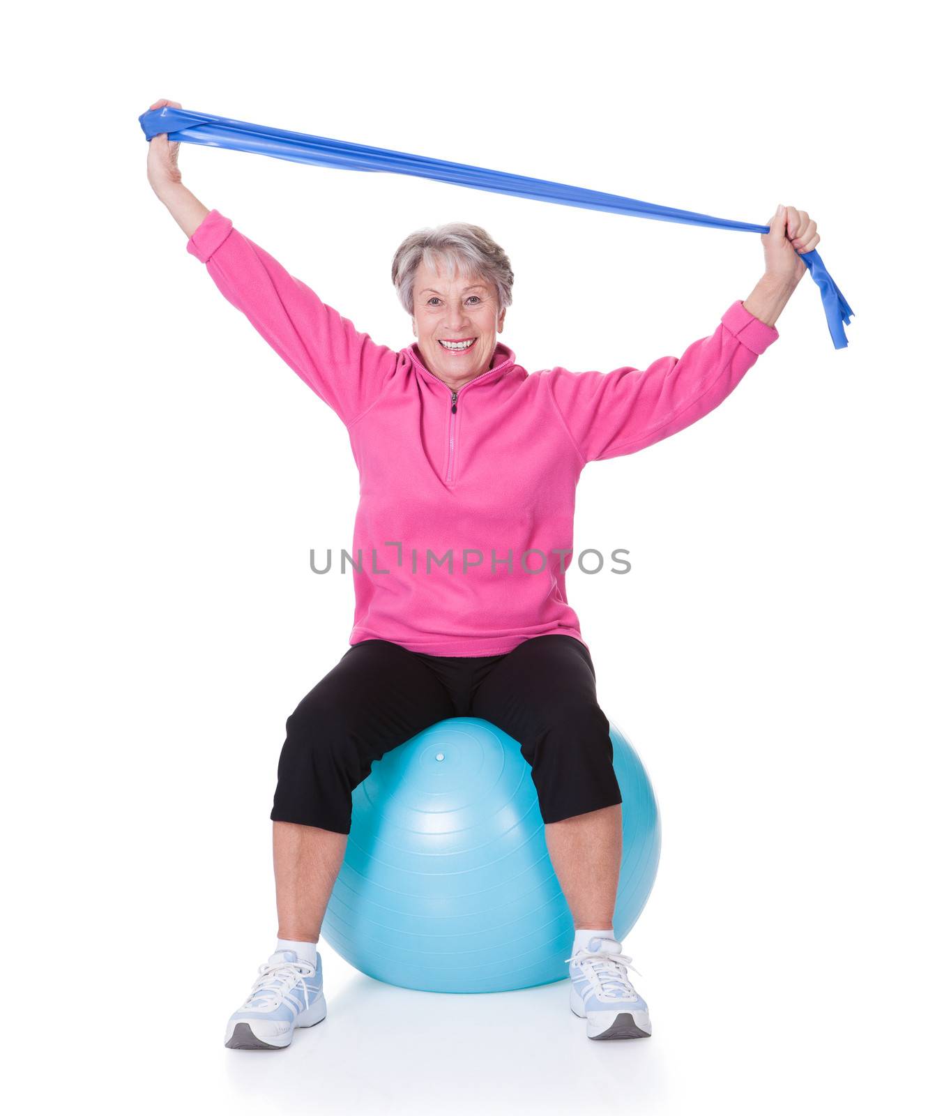 Senior Woman Stretching Exercising Equipment by AndreyPopov