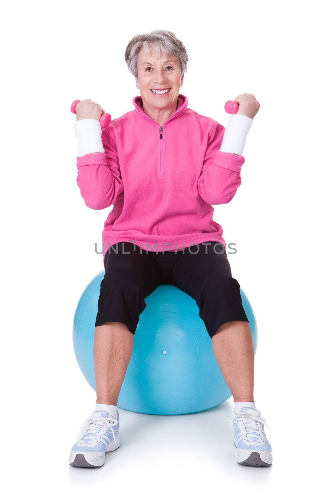 Senior Woman Exercising With Dumbbells On White Background