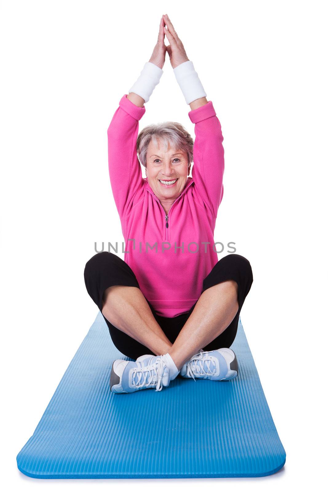 Senior Woman Practicing Yoga On White Background