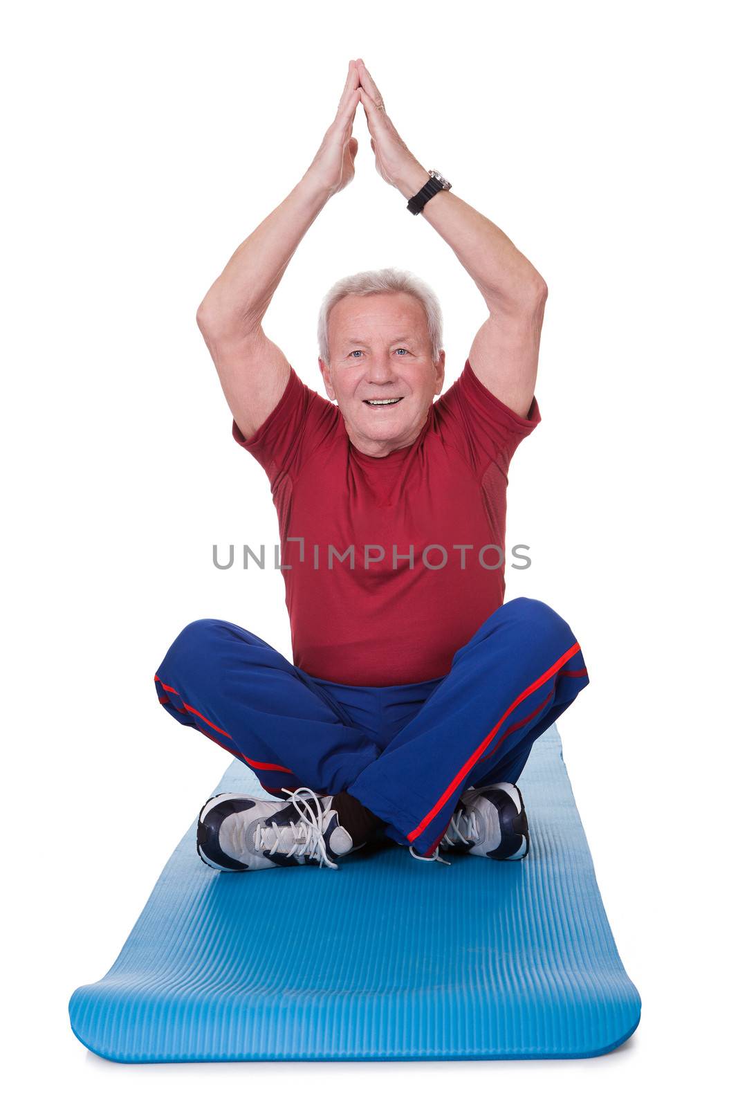 Senior Man Practicing Yoga On White Background