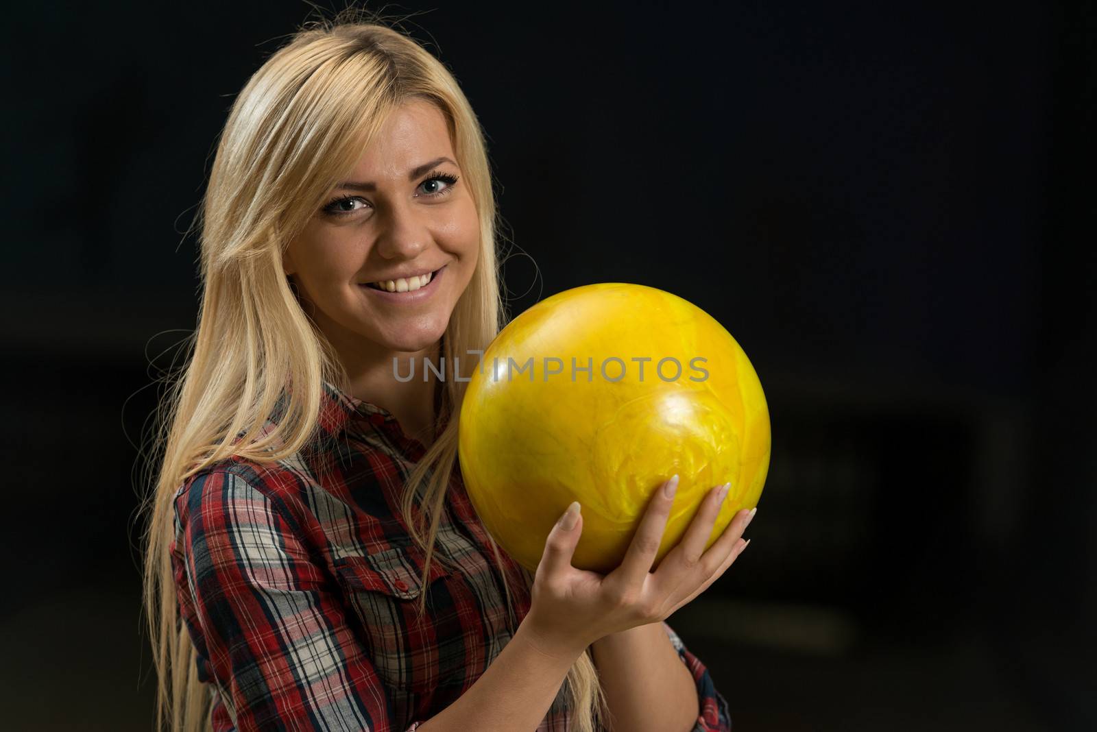 Women Holding A Bowling BallWomen Holding A Bowling Ball by JalePhoto