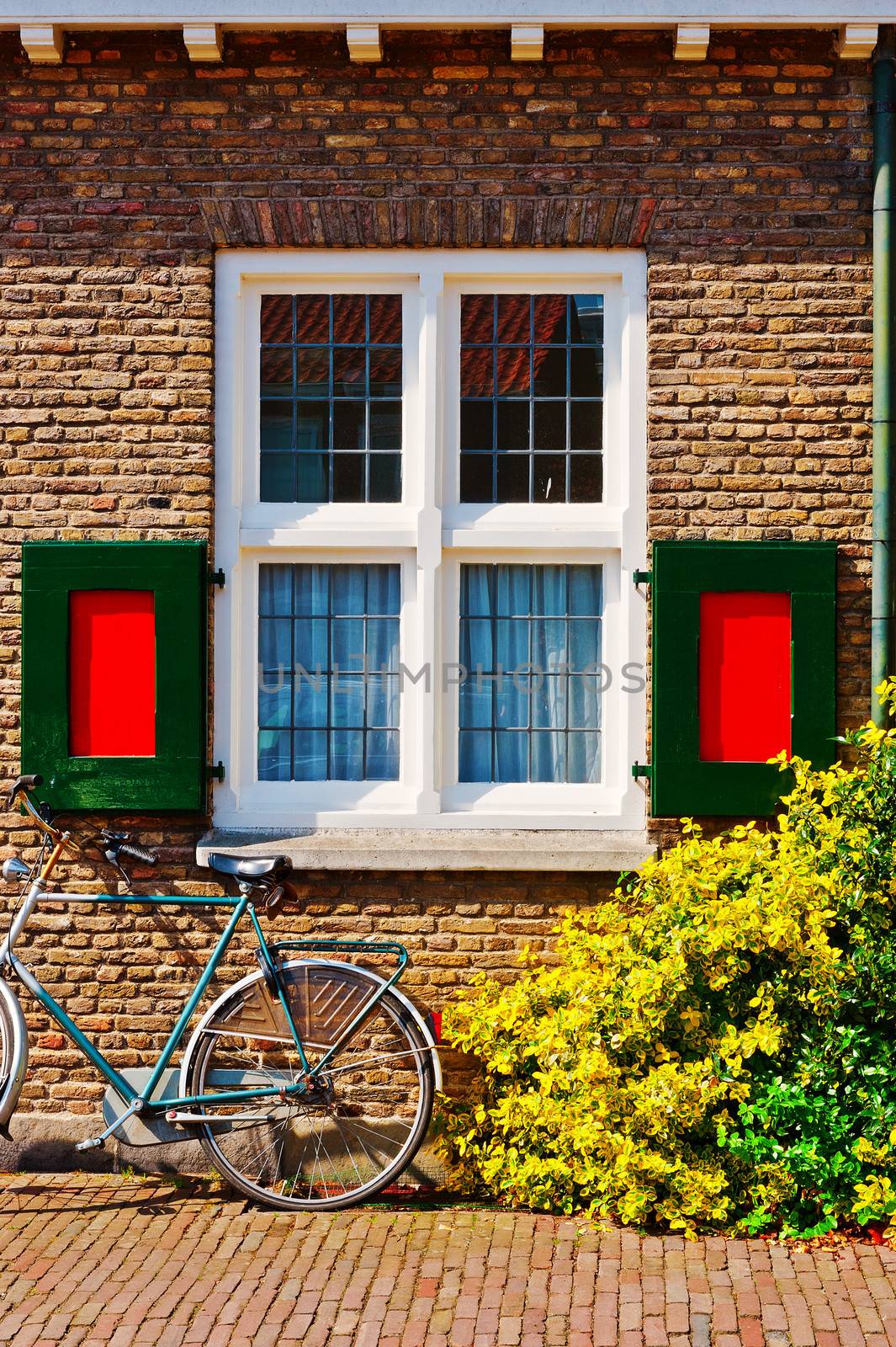 Window with Red Shutters in the Dutch City