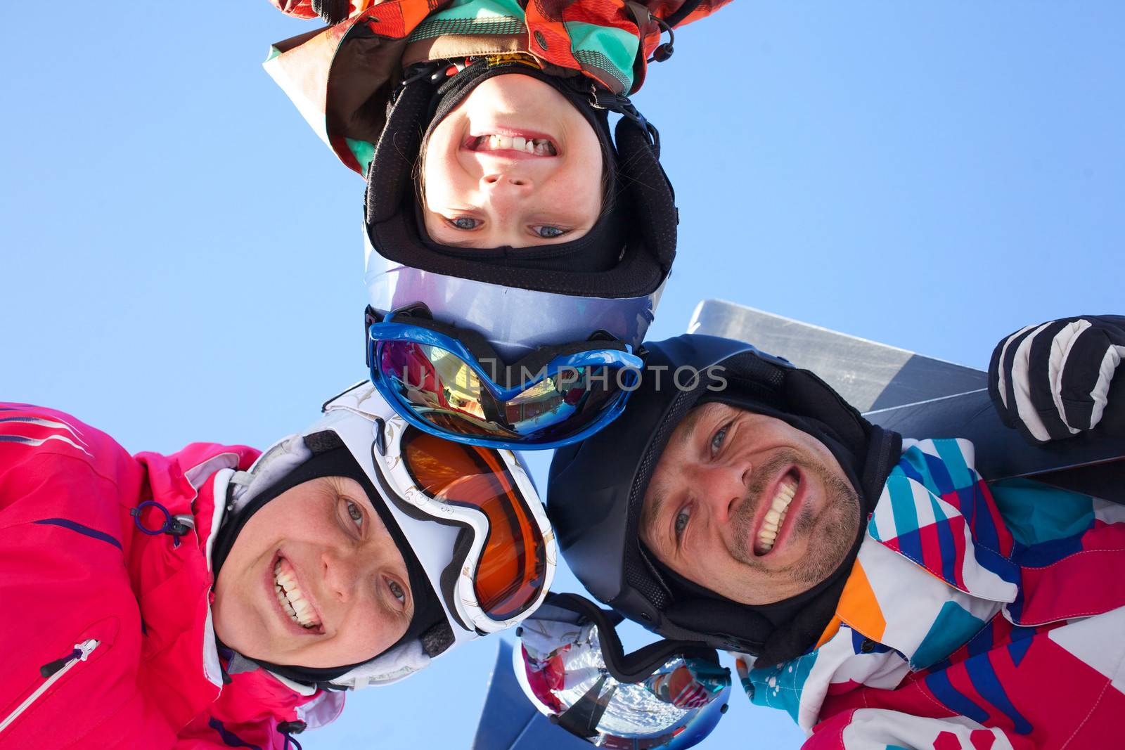 Skiing, winter fun - skiers enjoying ski holidays by maxoliki