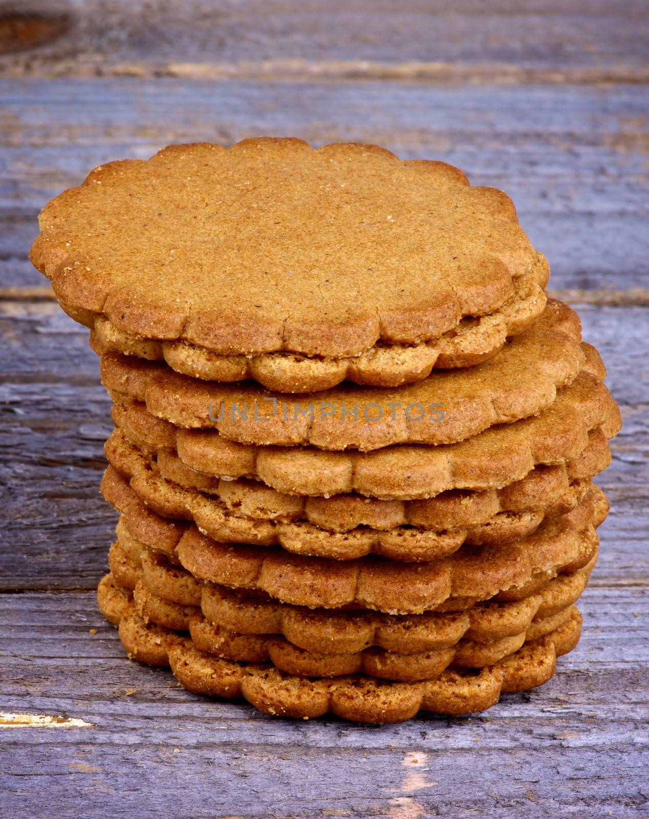 Stack of Homemade Ginger Cookies isolated on Rustic Wooden background