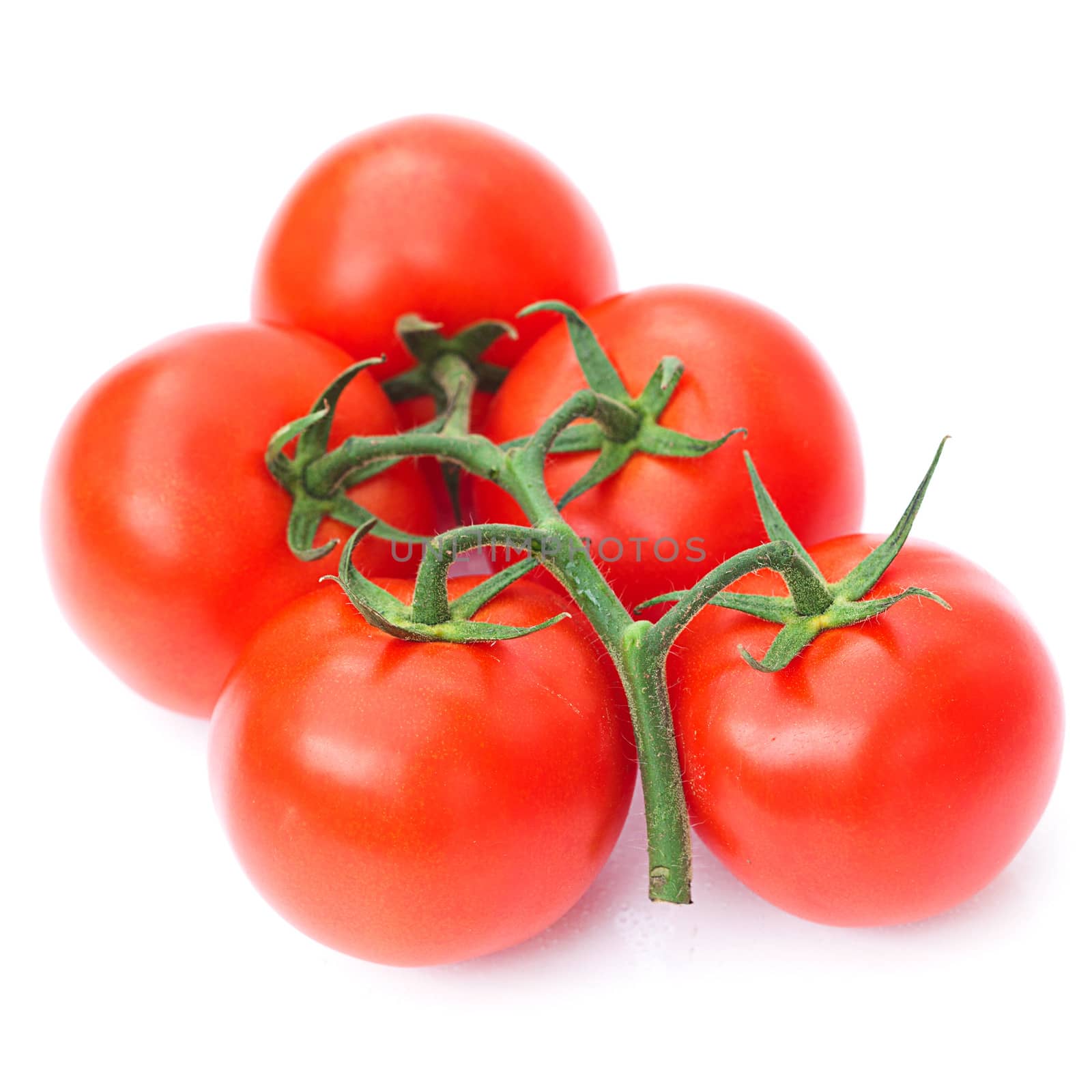 red ripe tomato isolated on white by jannyjus