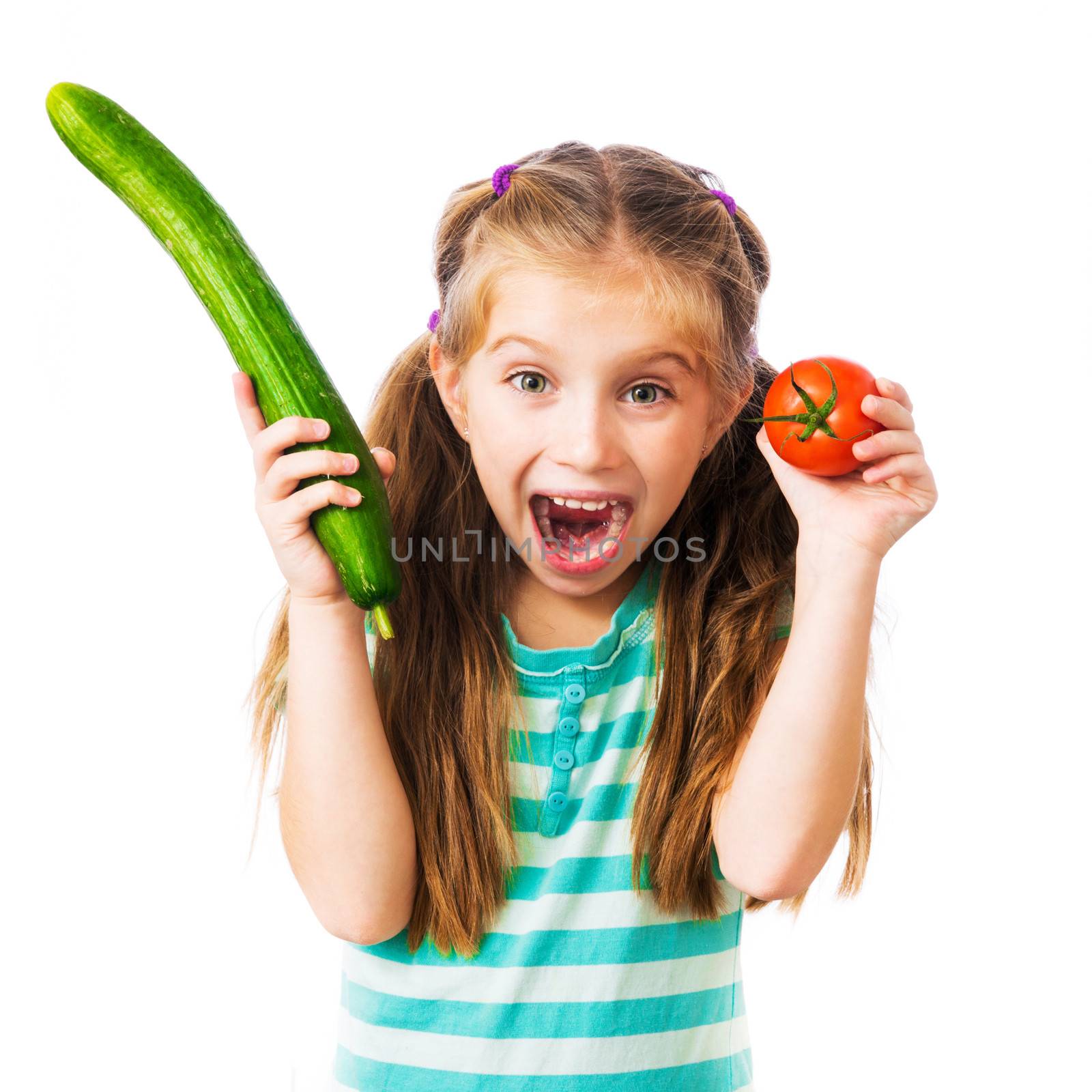 little girl with a tomato and cucumber isolated on white background