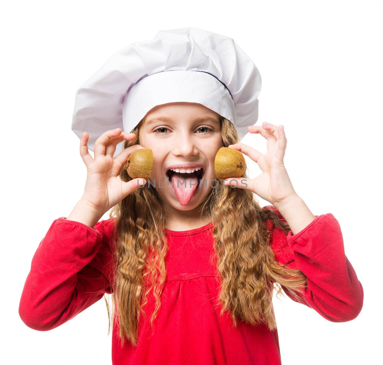 little girl in chef hat with dvemya rugs kiwi shows tongue on white background