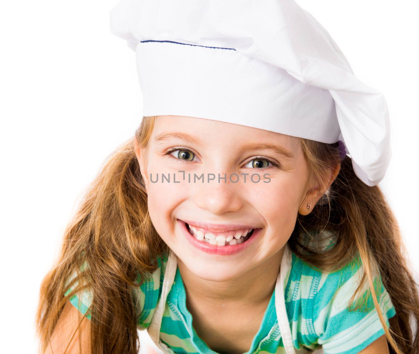 smiling little girl in chef hat on a white background