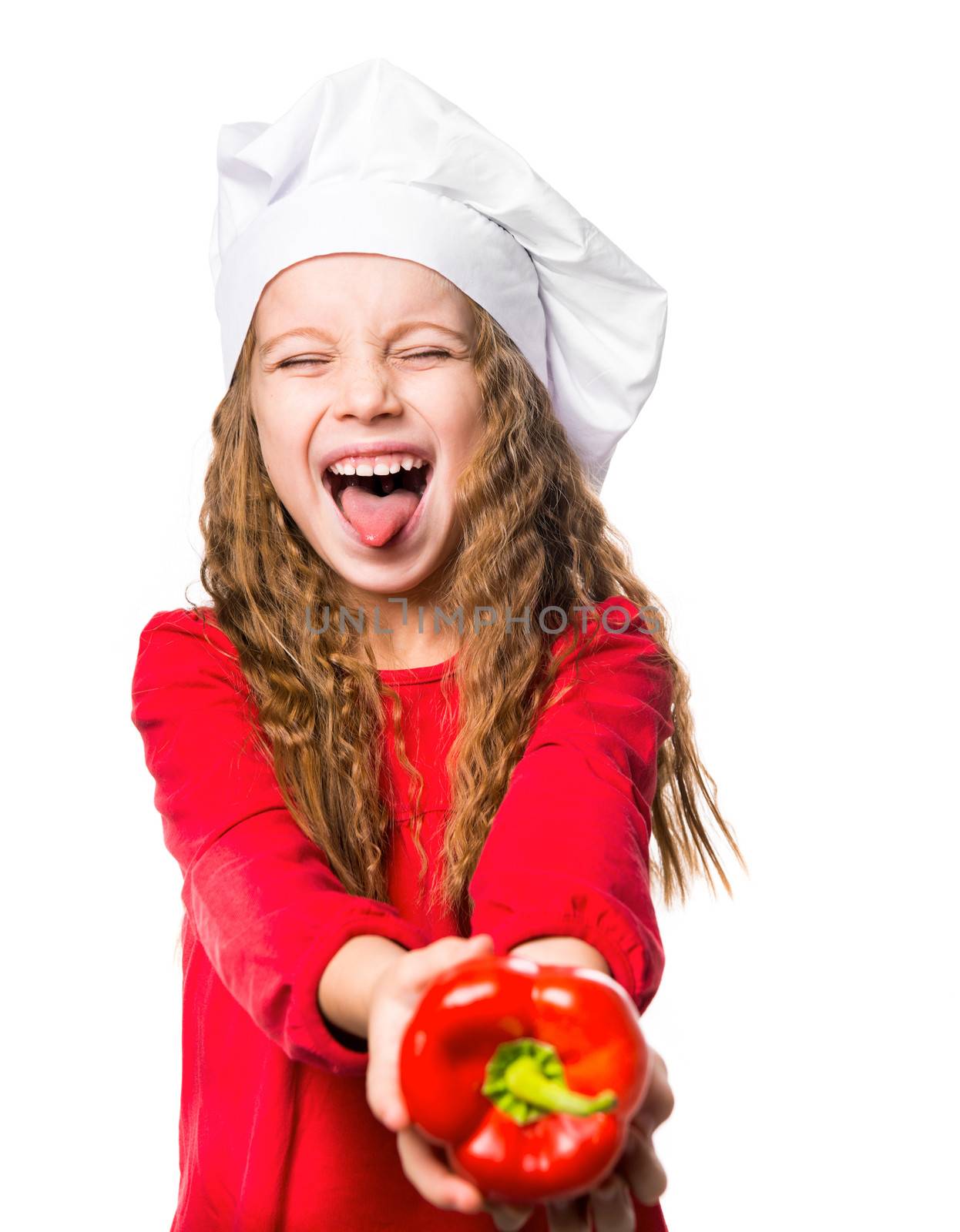 little girl in chef hat with red bell pepper up on a white background