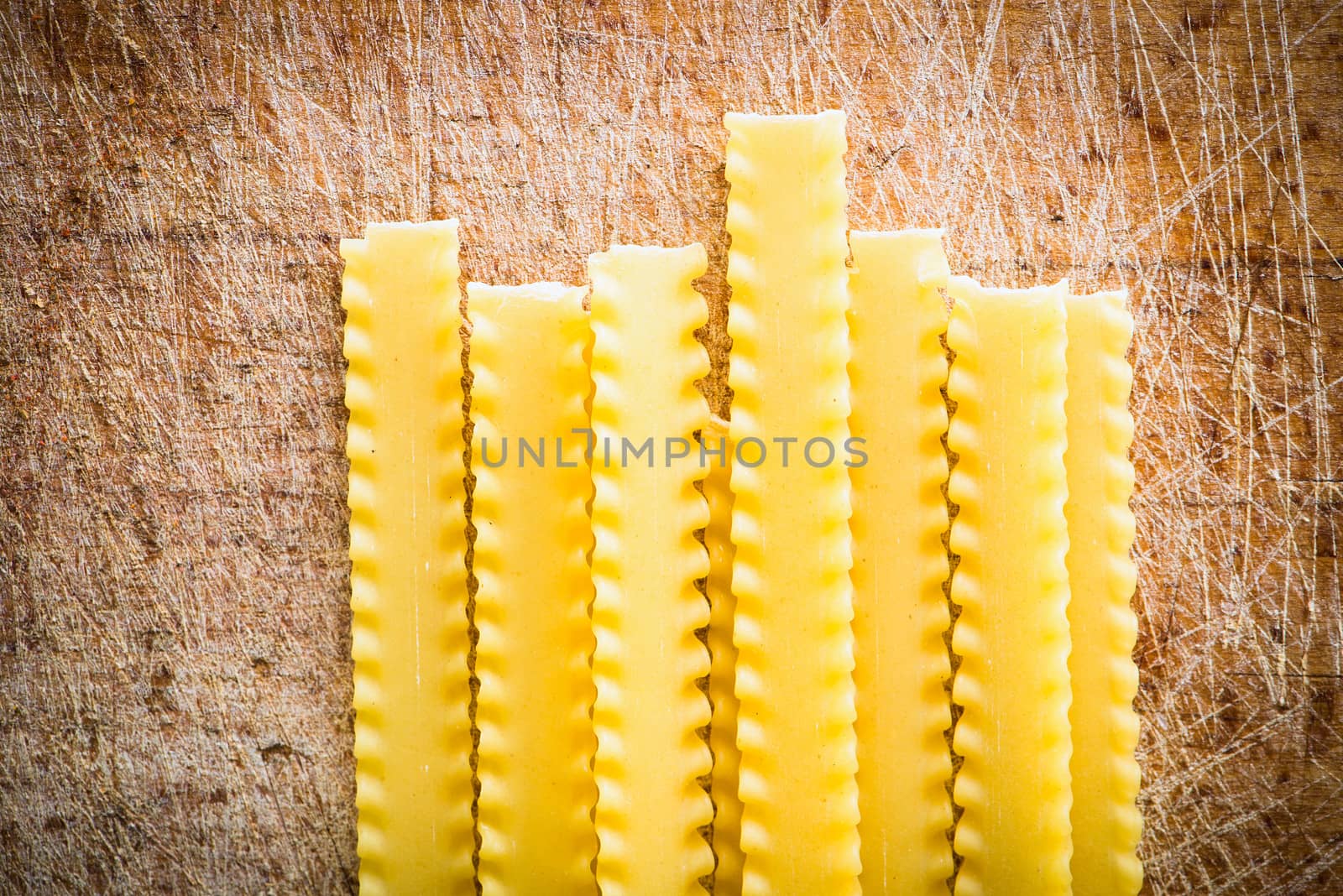 uncooked pasta on a wooden cutting board