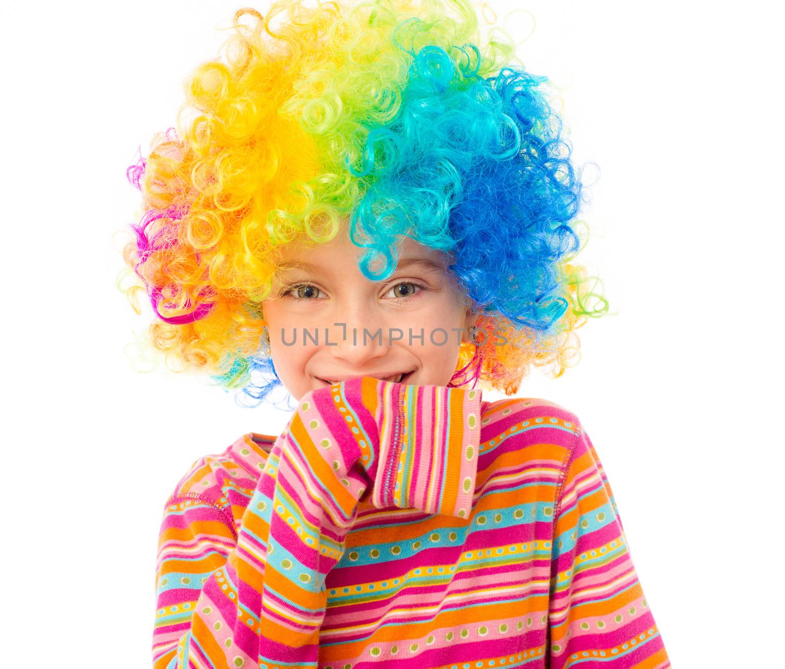 funny little girl in clown wig isolated on white background