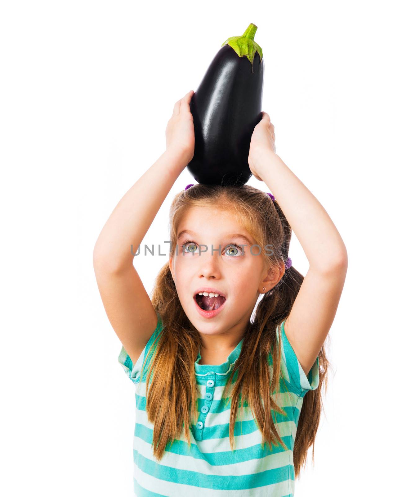 little girl with eggplant on head