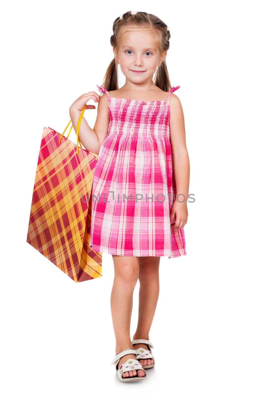 cute little girl with shopping bag isolated on white background