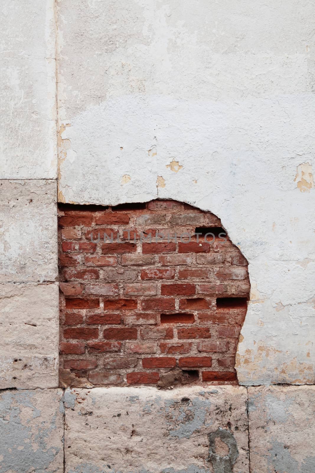 Destroyed concrete and brick wall