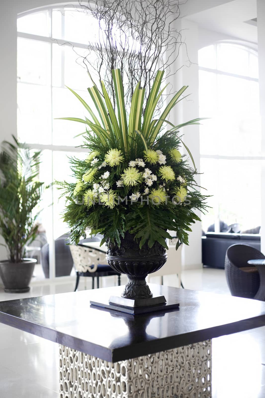 Beautiful flower arrangement in large foyer by jarenwicklund