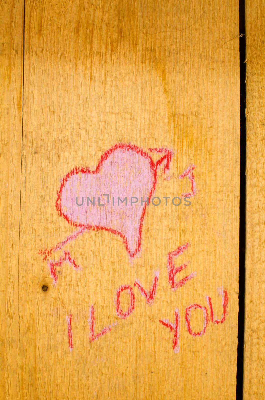 Valentines graffiti on the planks of an old wooden door