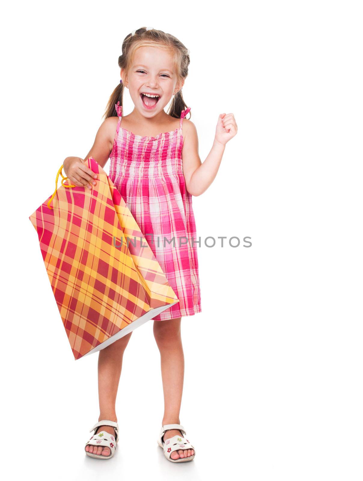 smiling little girl with shopping bag isolated on white background