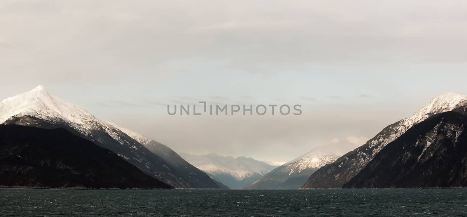 Snowcovered Mountains in  Alaska. Chilkat State Park. Mud Bay. HAINES. Alaska. USA