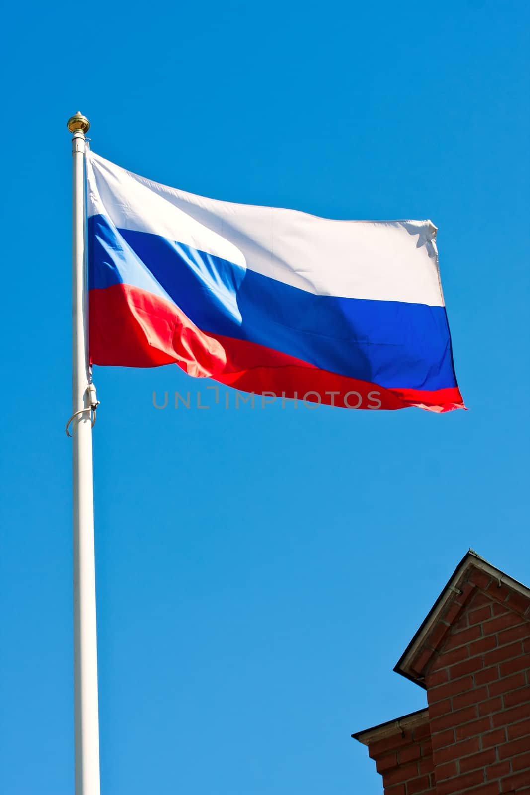 Russian flag on  background of blue sky