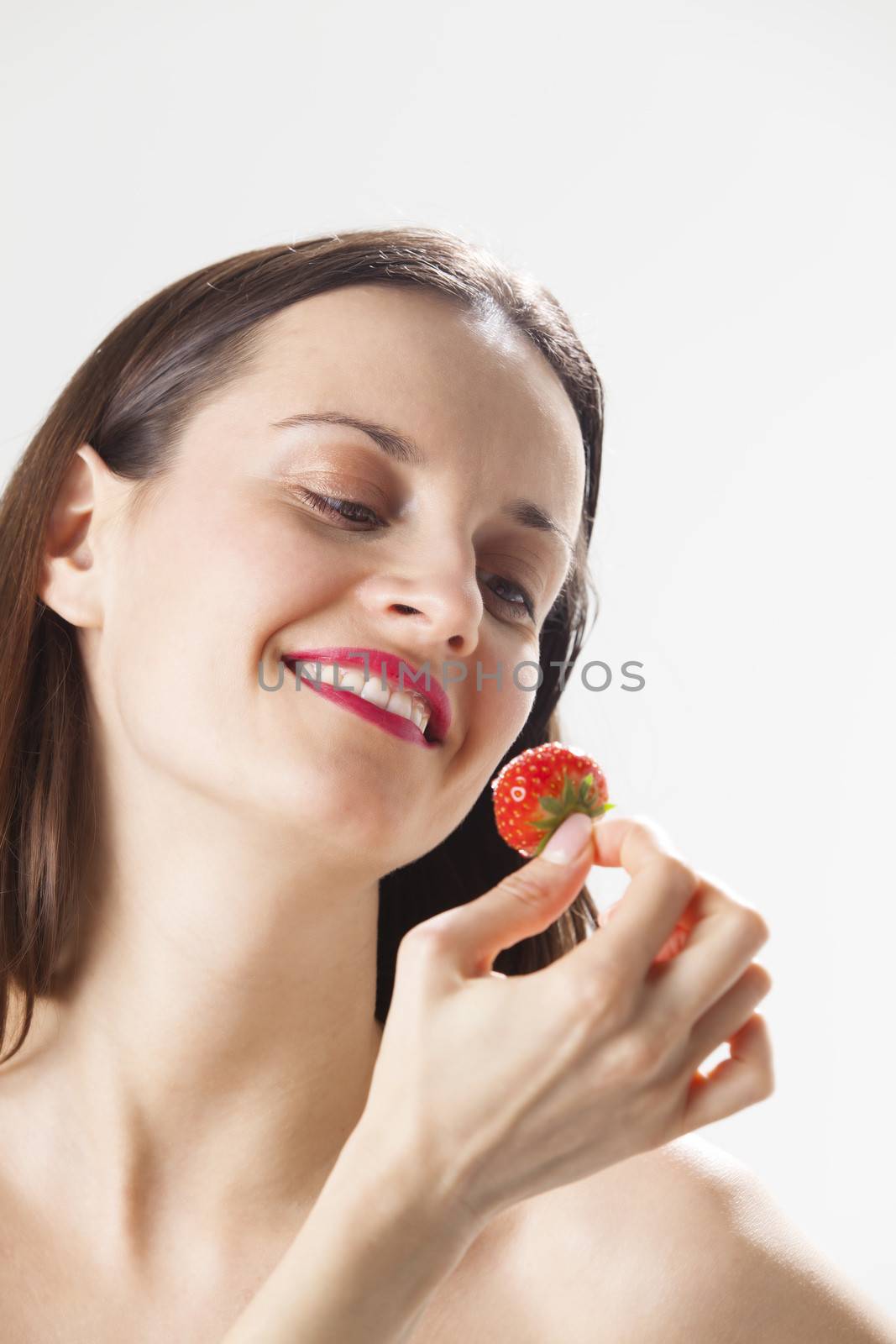 young woman with a strawberry