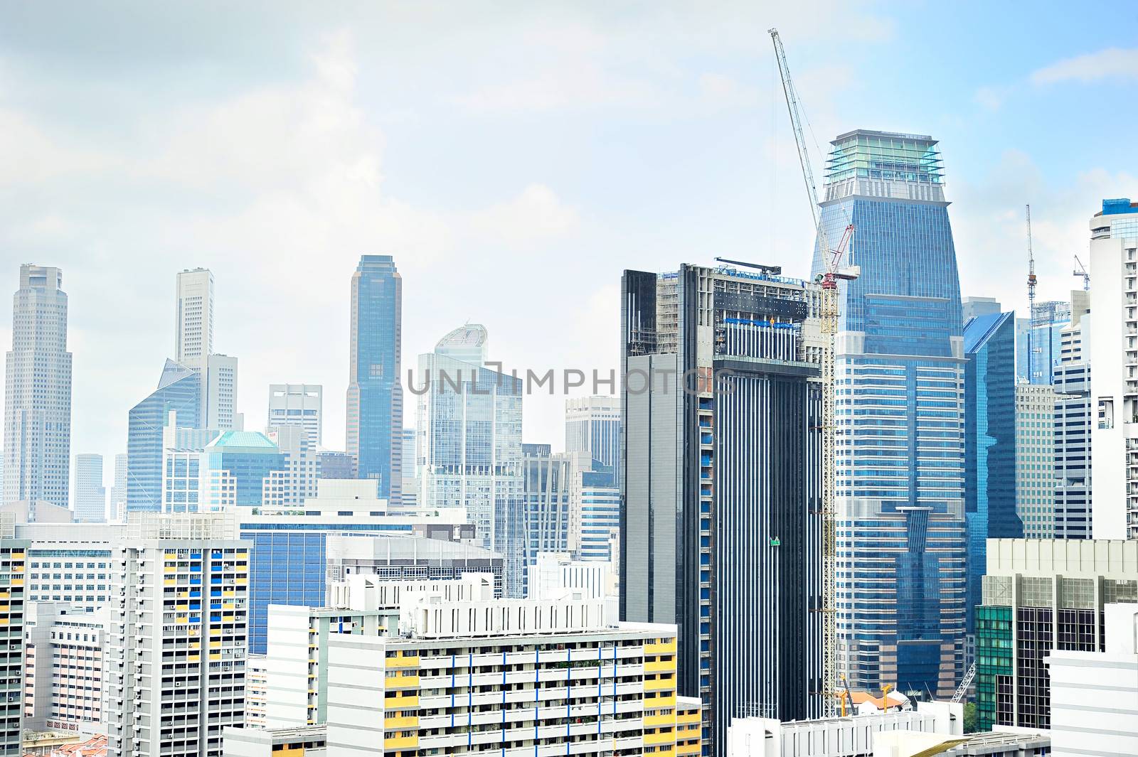 Skyline of Singapore downtown with a construction site on foreground