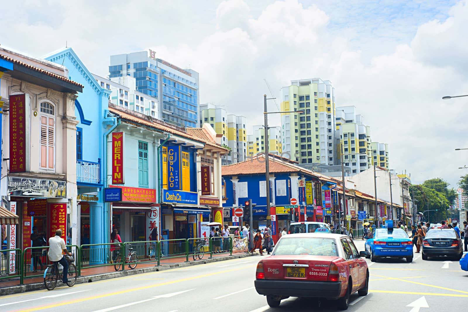 SINGAPORE - MAY 10, 2013: Busy street in Singapore's Indian quarter. One of the famous tourist attractions in the city crowded with people in the midday.