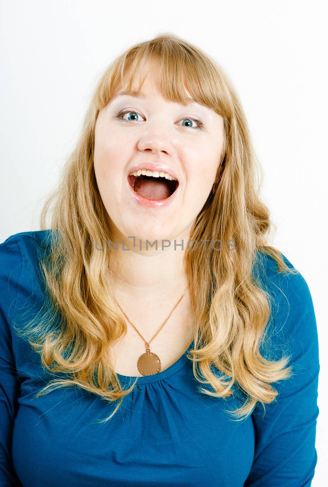portrait of a young blonde woman screaming