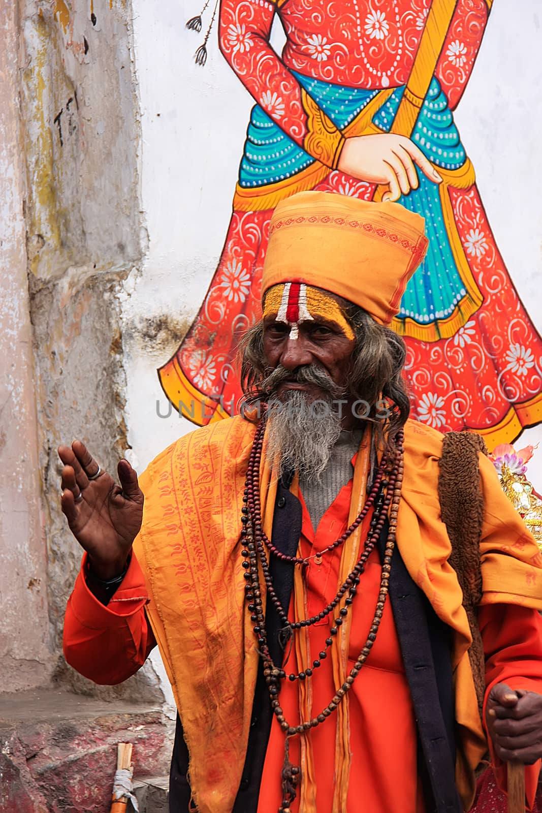 Indian man walking in the street of Udaipur, India by donya_nedomam