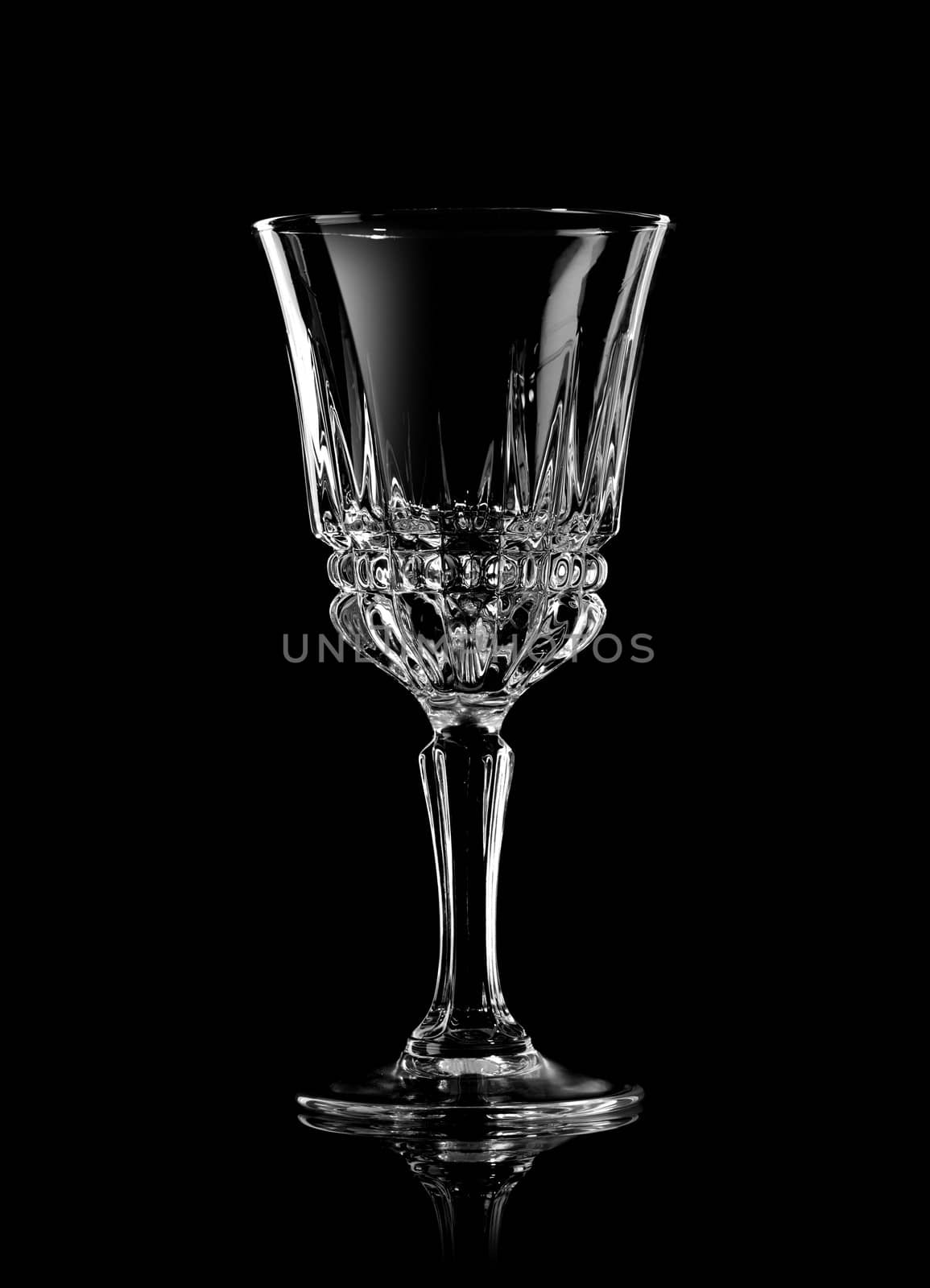 Empty wine glass on a black background