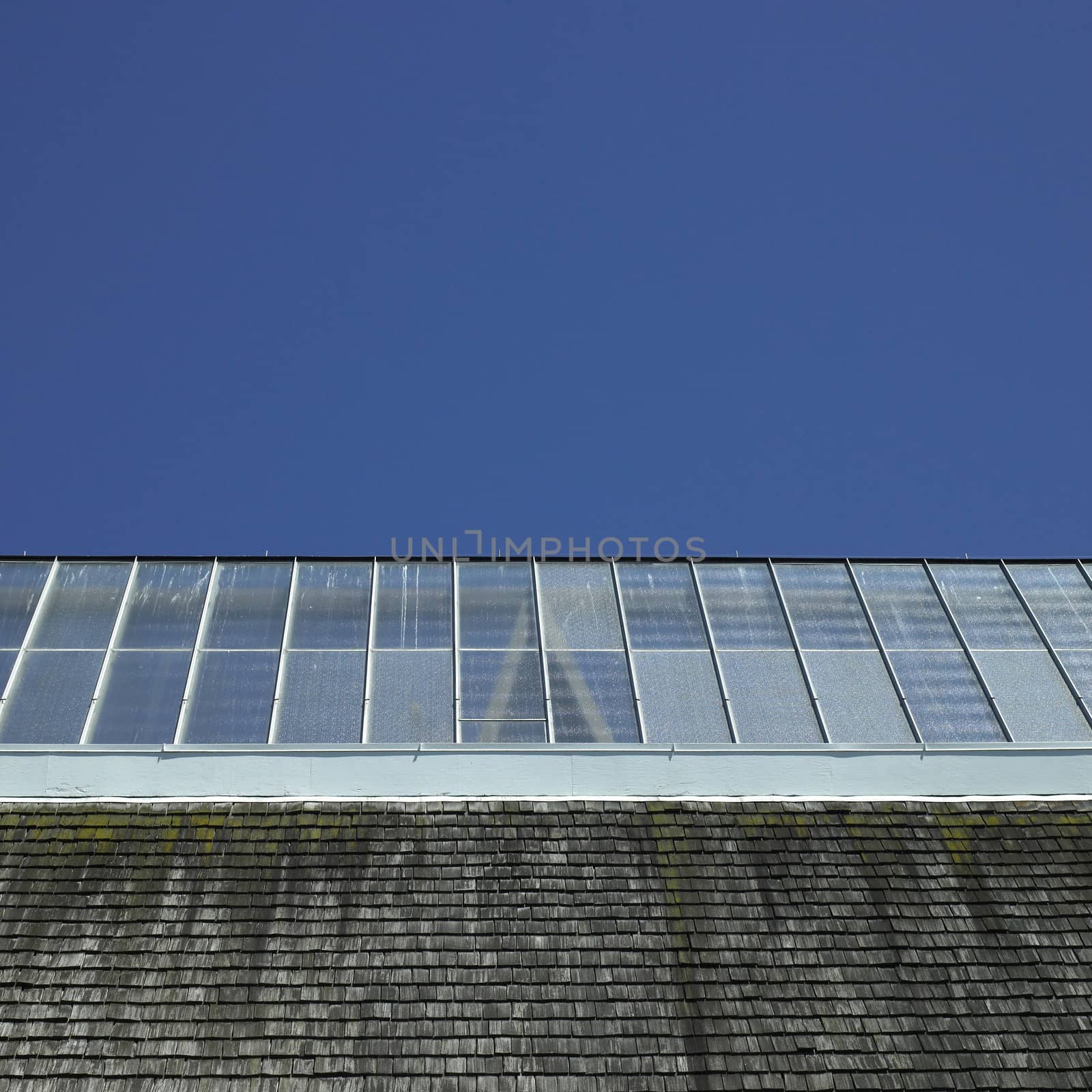 Building with glass roof and shingled wall