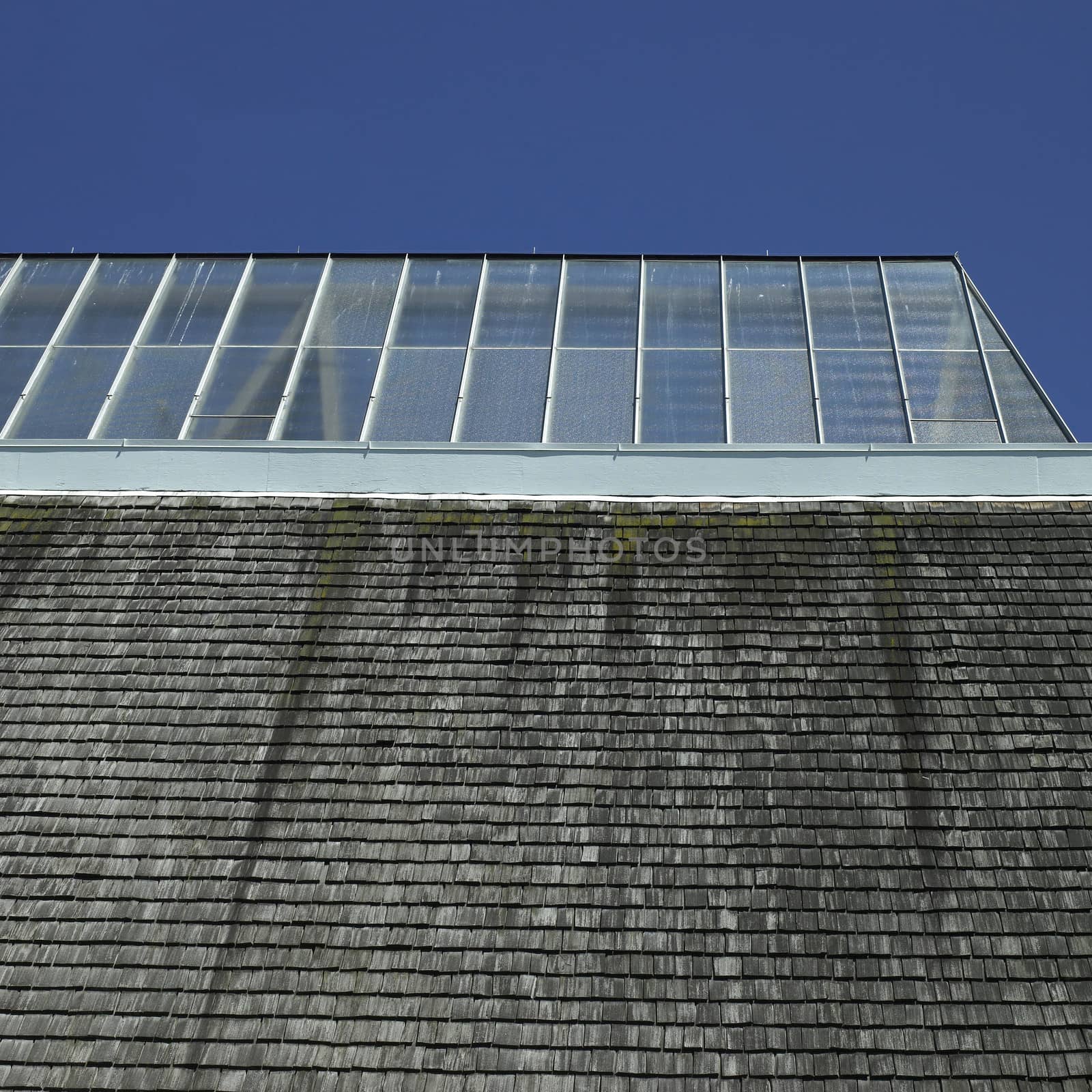 Building with glass roof and shingled wall
