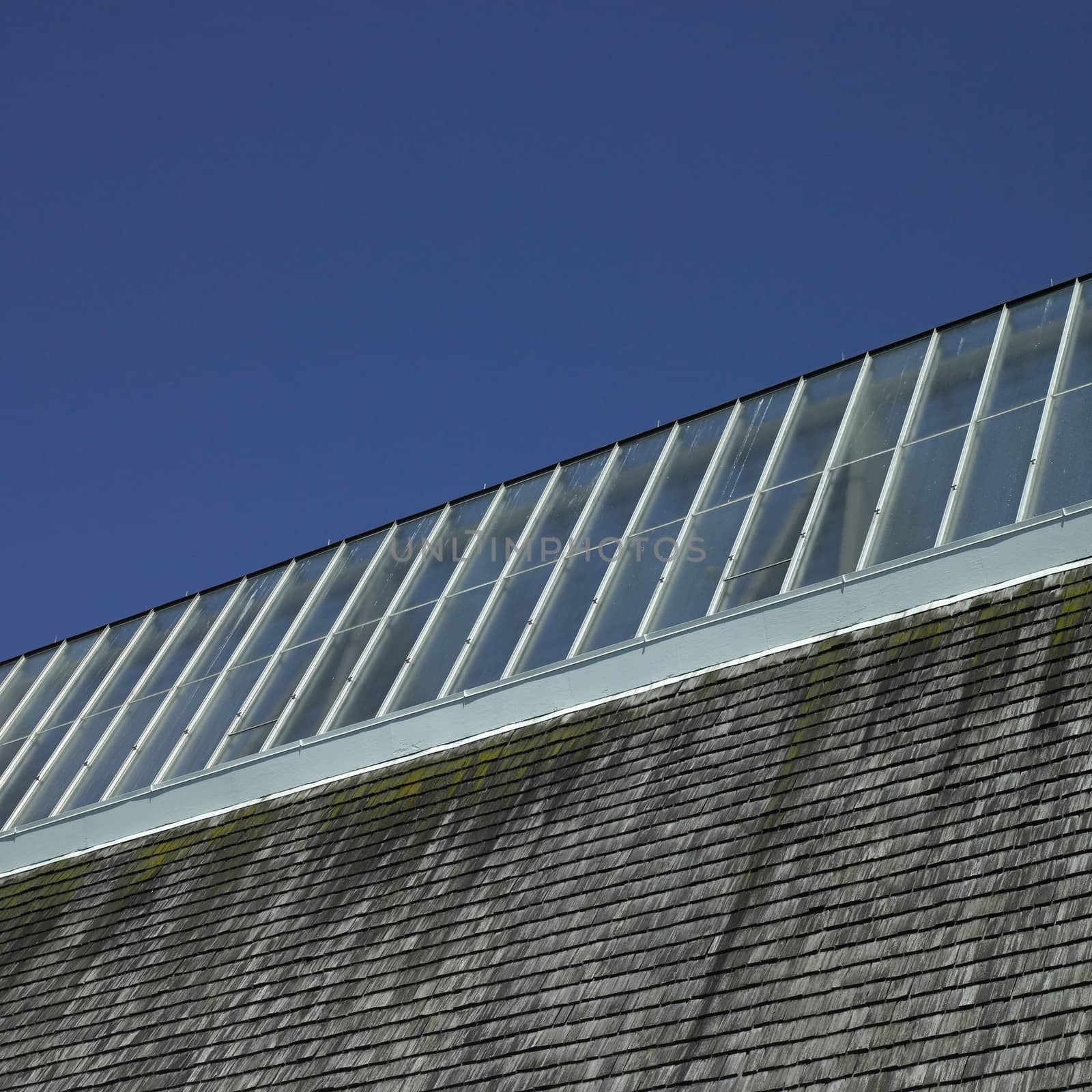 Building with glass roof and shingled wall