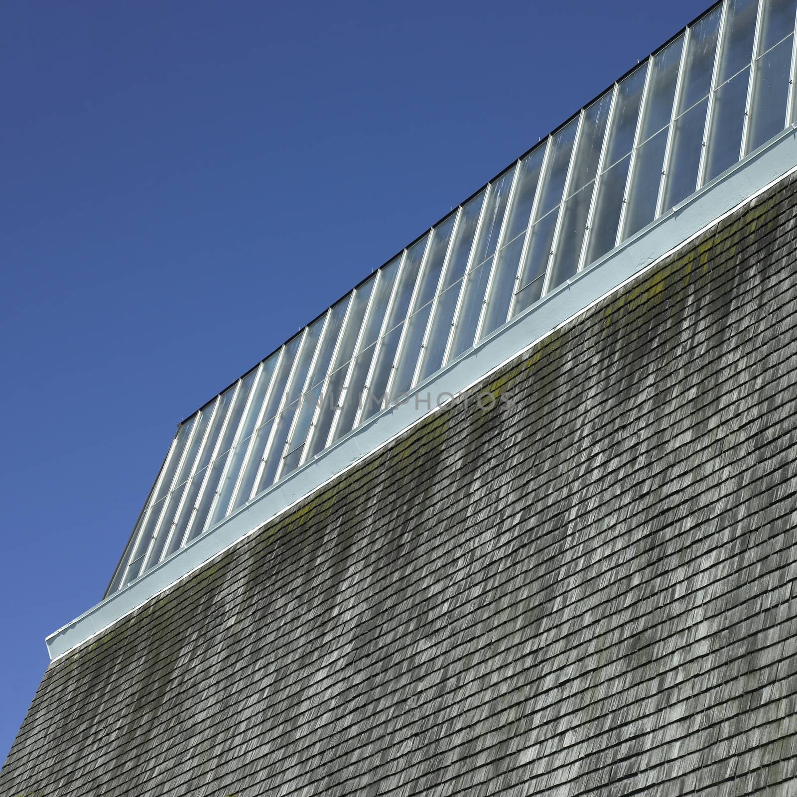 Building with glass roof and shingled wall