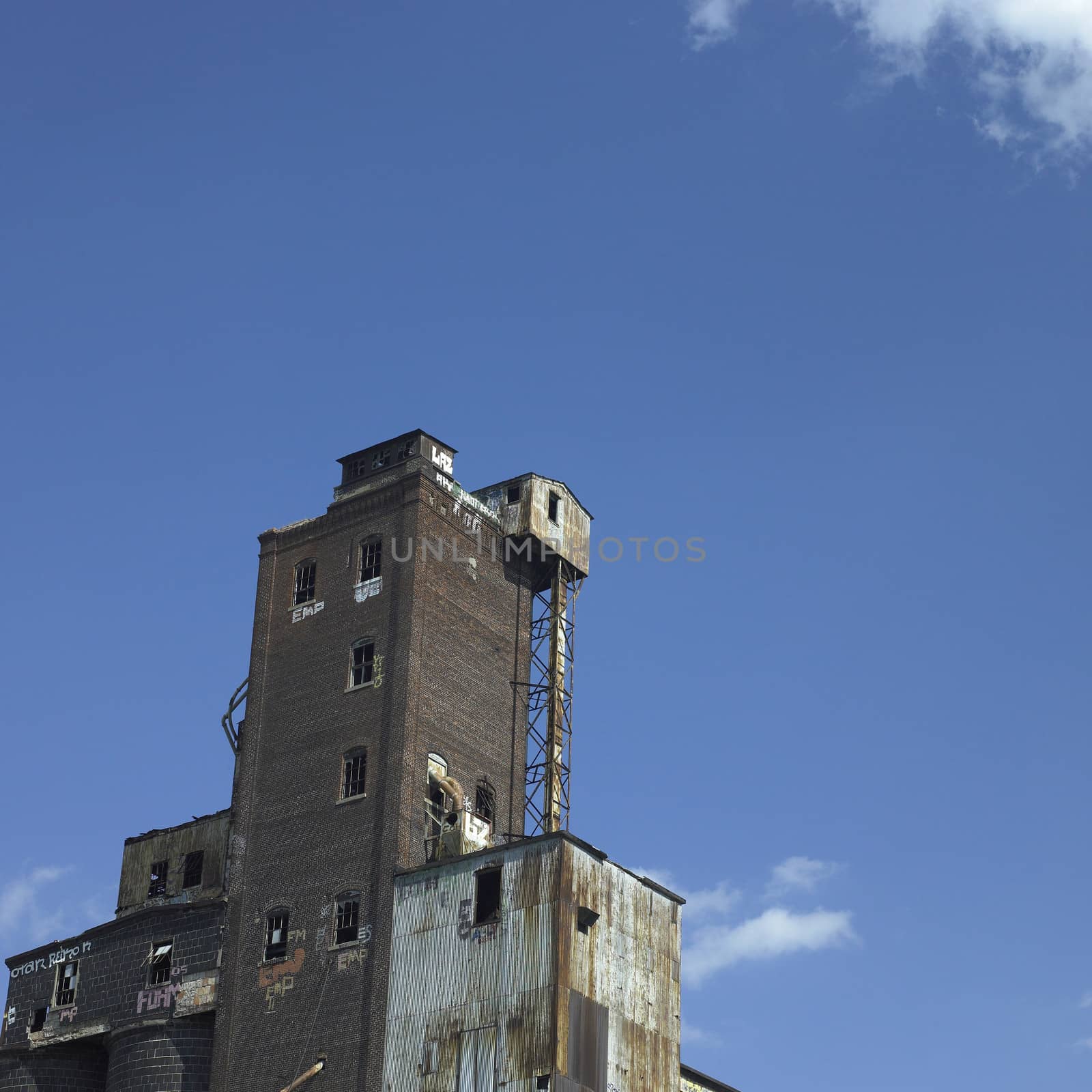 Large abandonned factory made of bricks and metal
