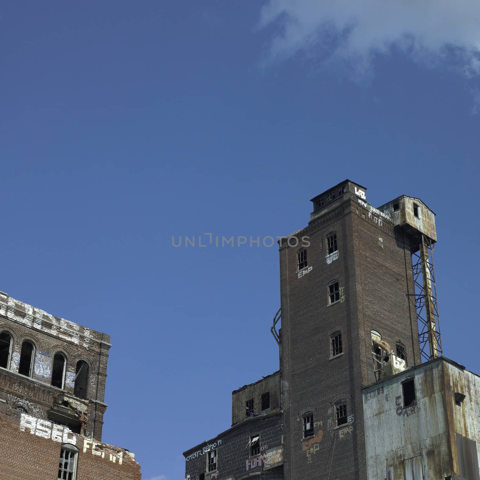 Large abandonned factory made of bricks and metal
