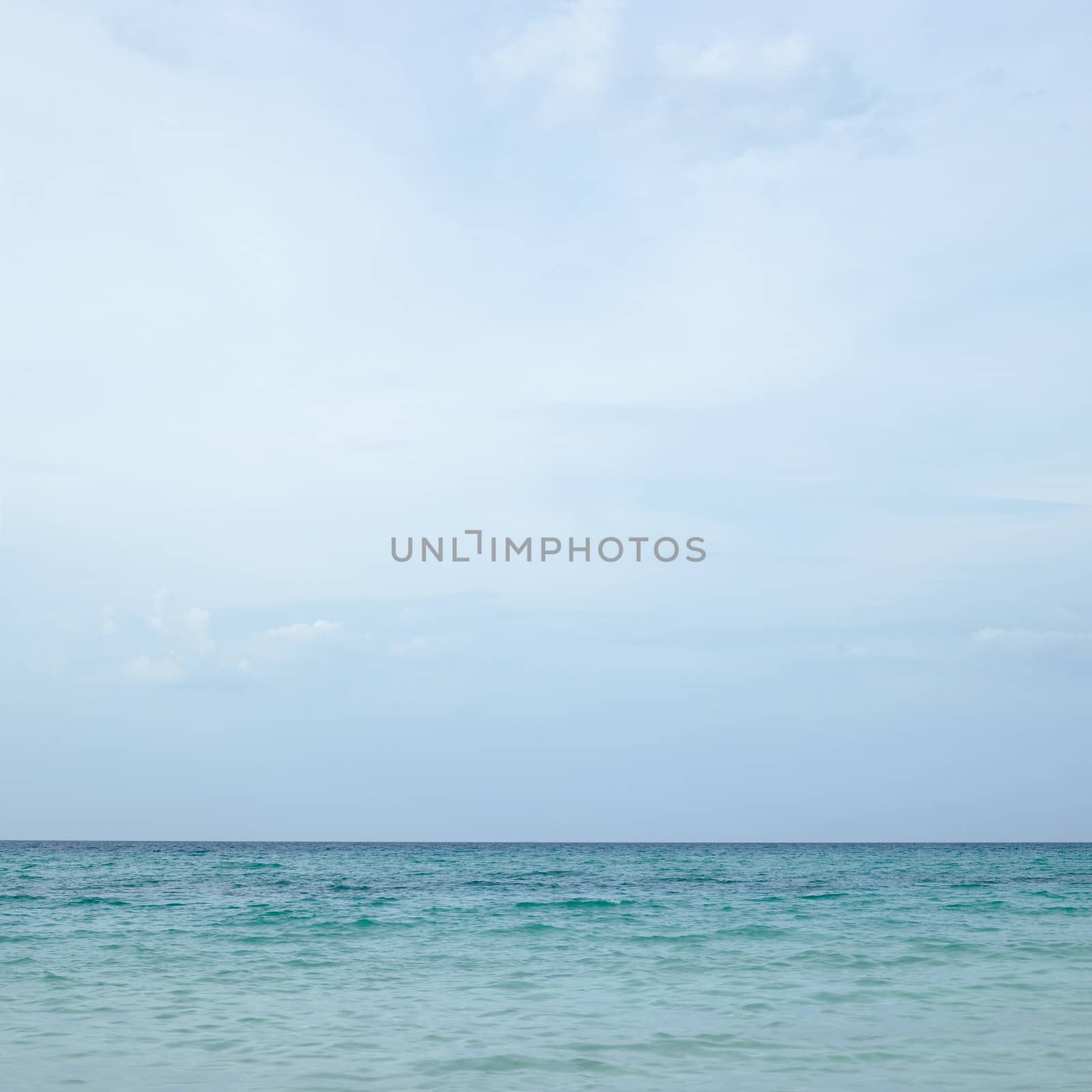 Beautiful blue wavy ocean with blue sky