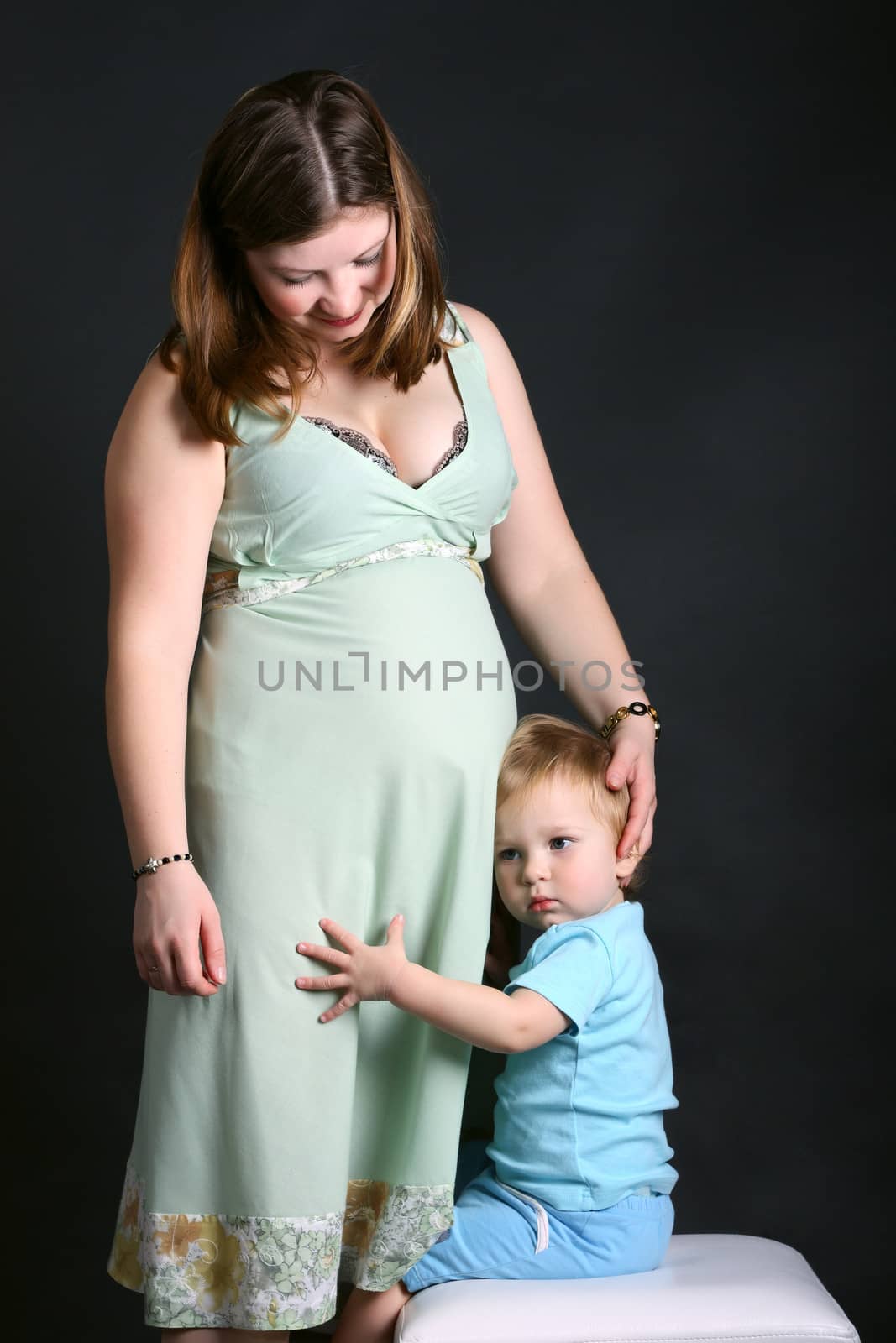 Pregnant women with her son family portrait