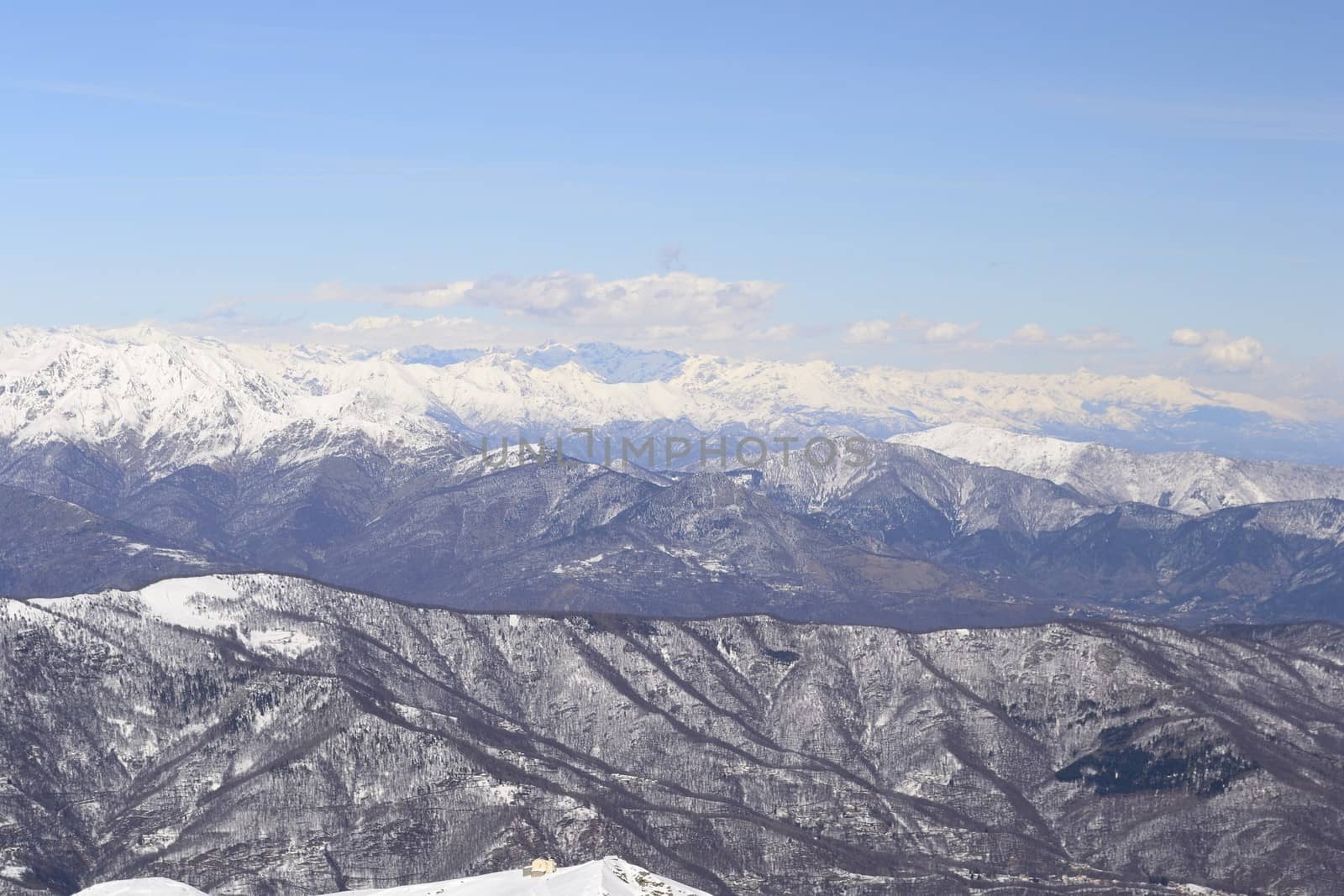 Candid off-piste ski slope in scenic background of high mountain peak