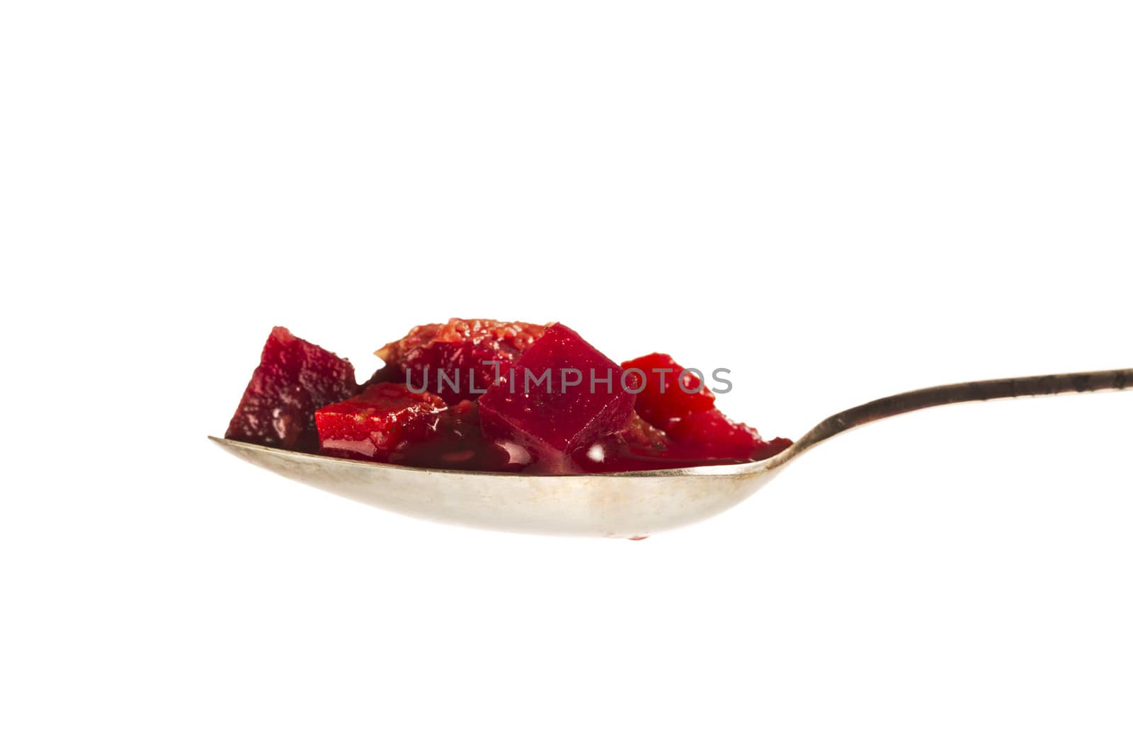 Isolated spoonful of borscht soup.