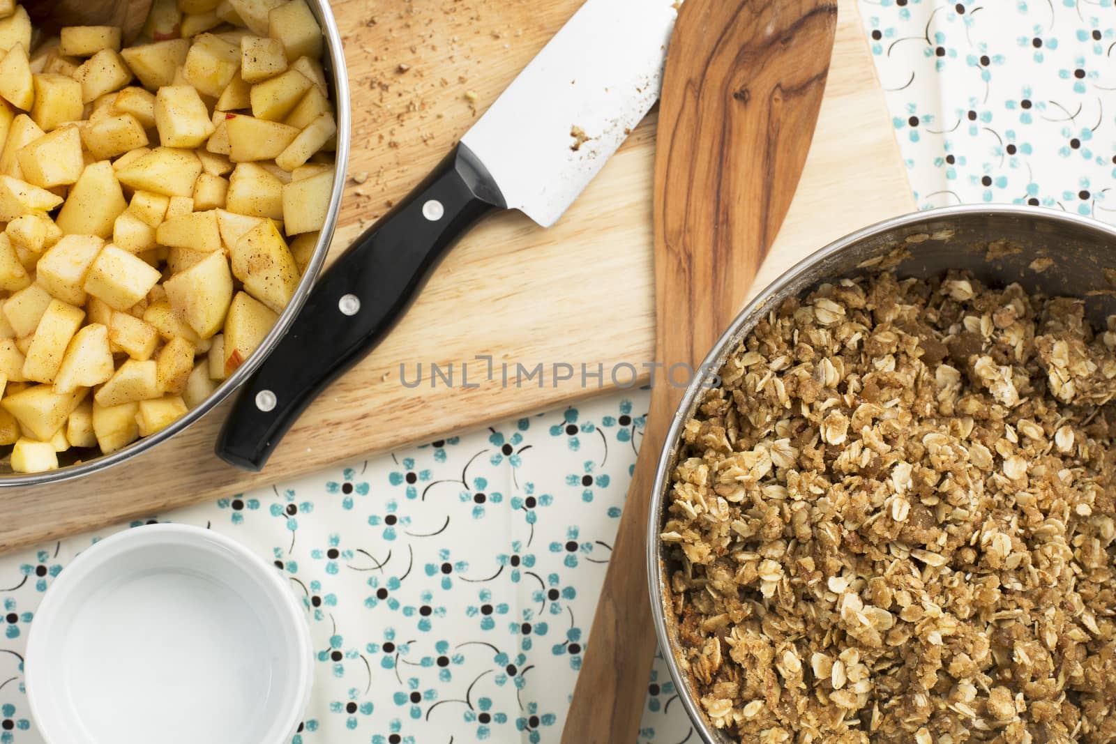Ingredients and cooking utensils used for making apple crumble
